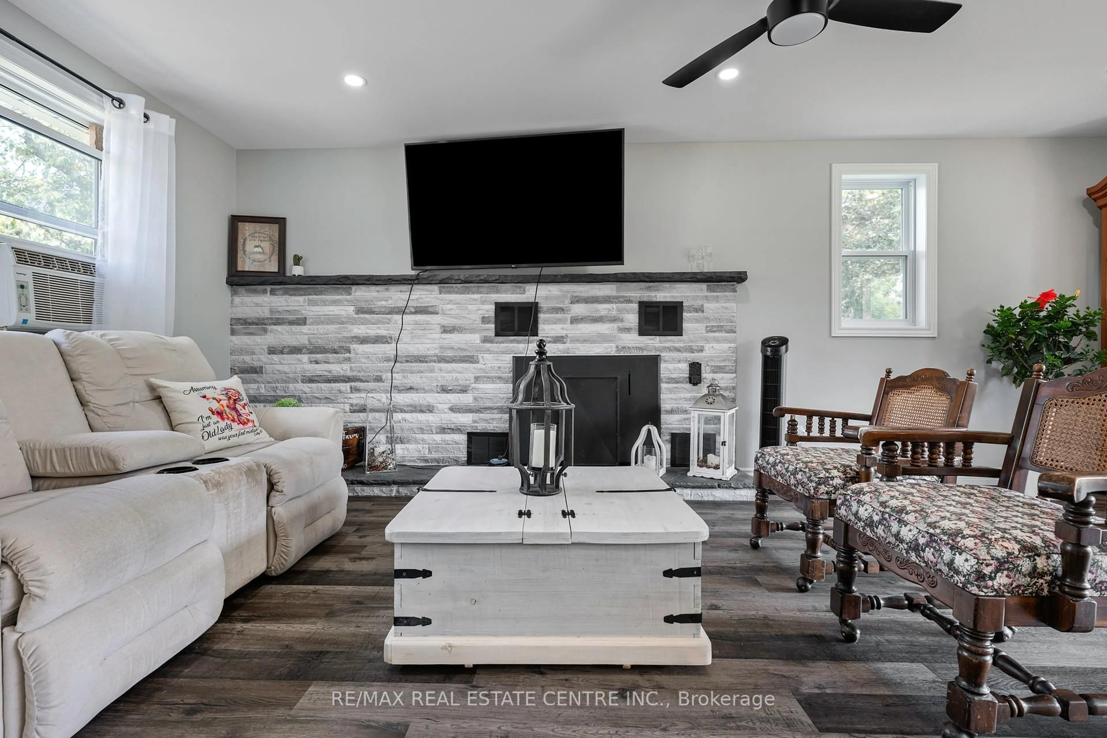 Living room with furniture, ceramic/tile floor for 517454 County Road 124 Rd, Melancthon Ontario L9V 1V7