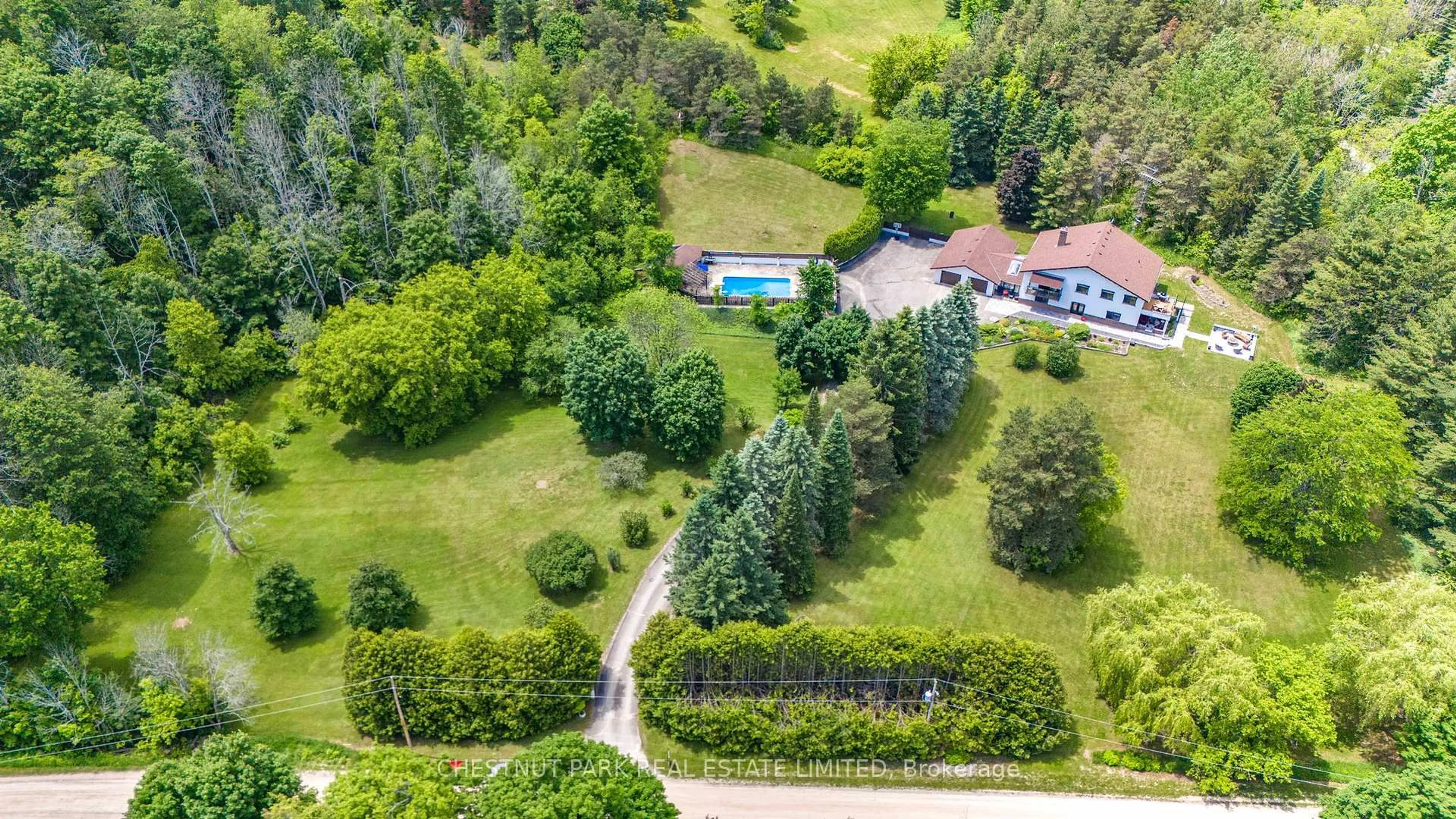 A pic from outside/outdoor area/front of a property/back of a property/a pic from drone, forest/trees view for 12 Goulding Lane, Mono Ontario L9W 6H2