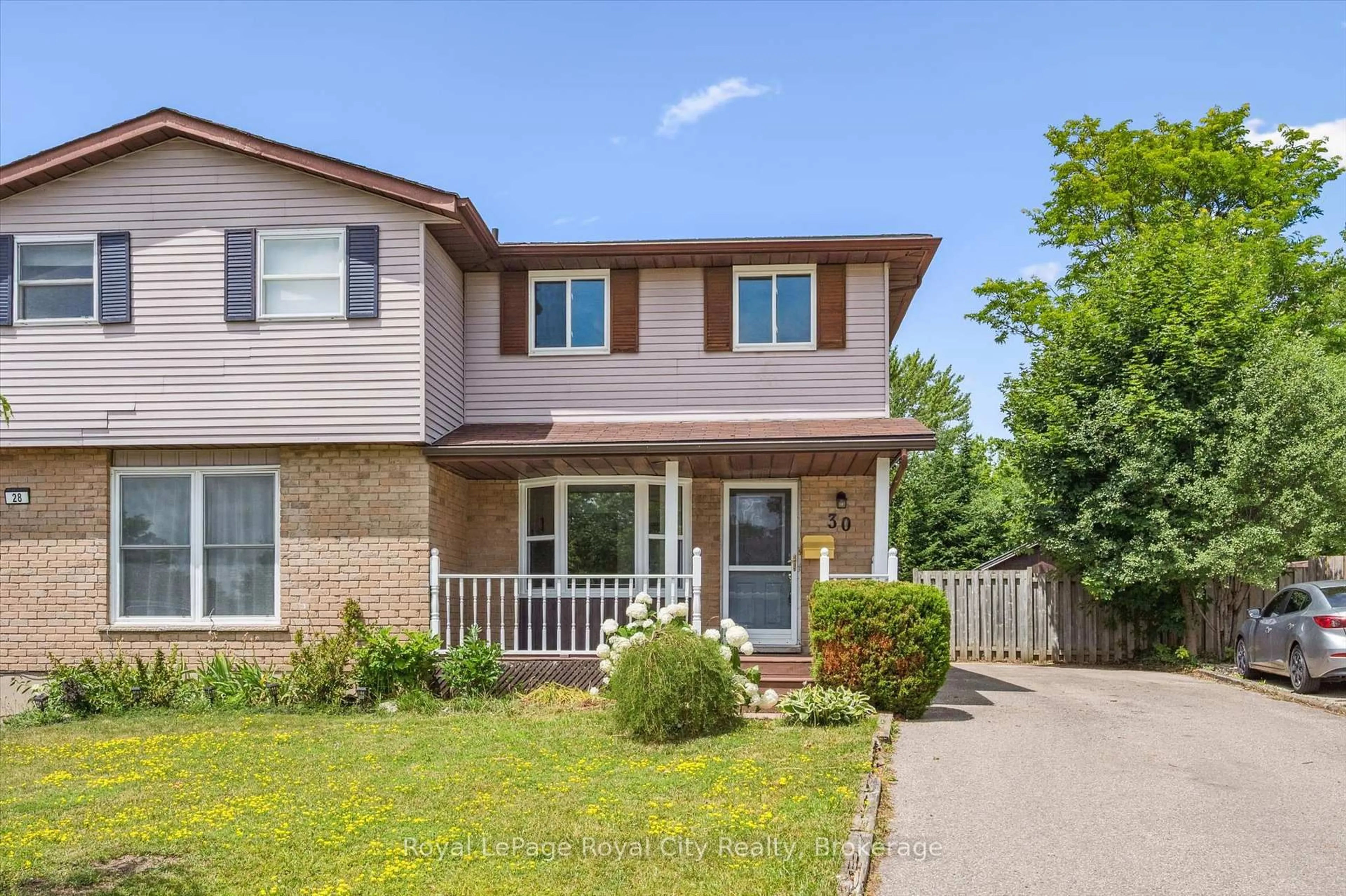 Home with brick exterior material, street for 30 Leacock Ave, Guelph Ontario N1E 6R1