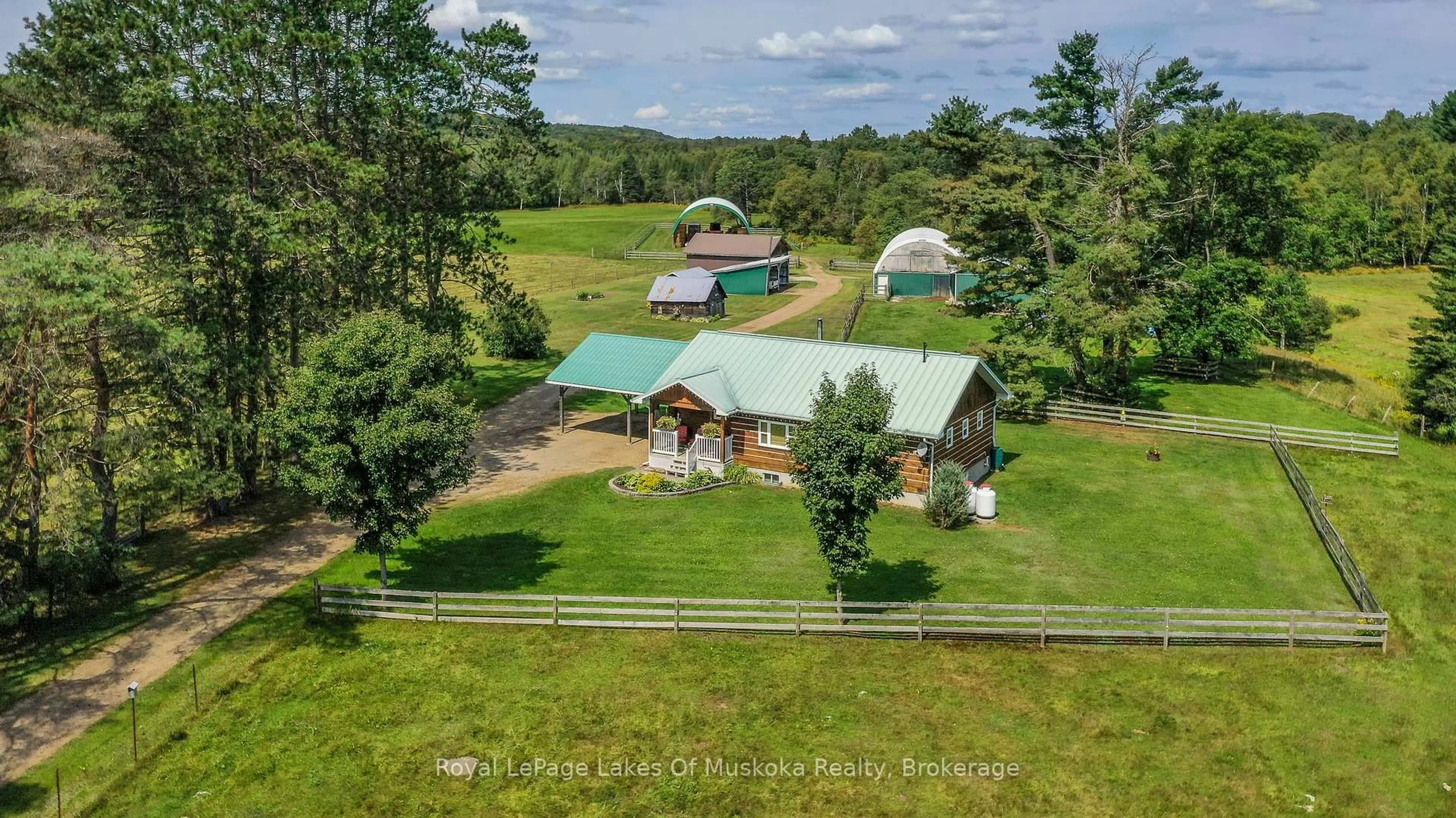 A pic from outside/outdoor area/front of a property/back of a property/a pic from drone, unknown for 214 NORTH LANCELOT Rd, Huntsville Ontario P0B 1M0