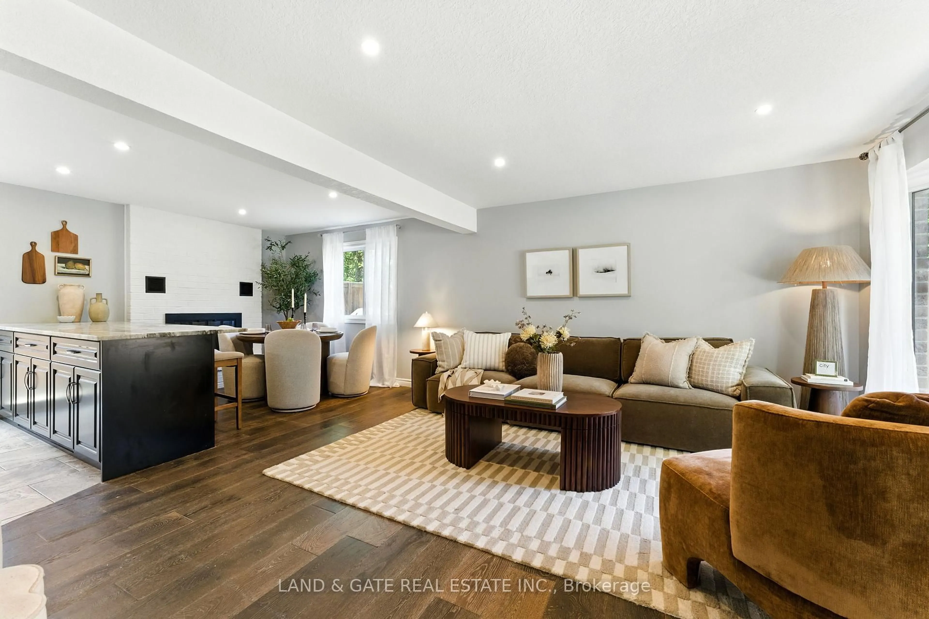 Living room with furniture, wood/laminate floor for 35 Aspen Valley Cres, Guelph Ontario N1G 3Z9