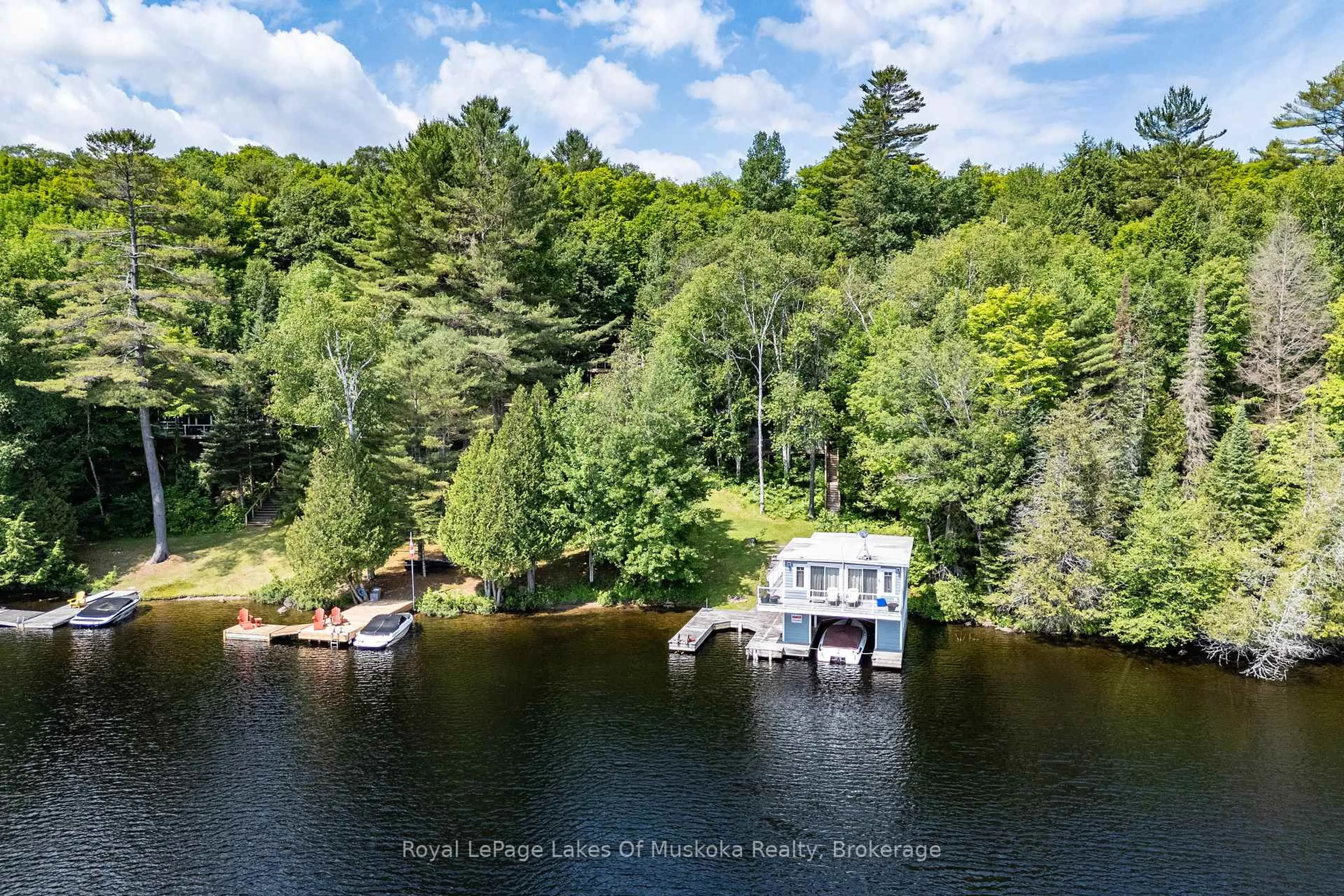 A pic from outside/outdoor area/front of a property/back of a property/a pic from drone, water/lake/river/ocean view for 1024/1025 White Pines Rd, Lake of Bays Ontario P1H 2J3