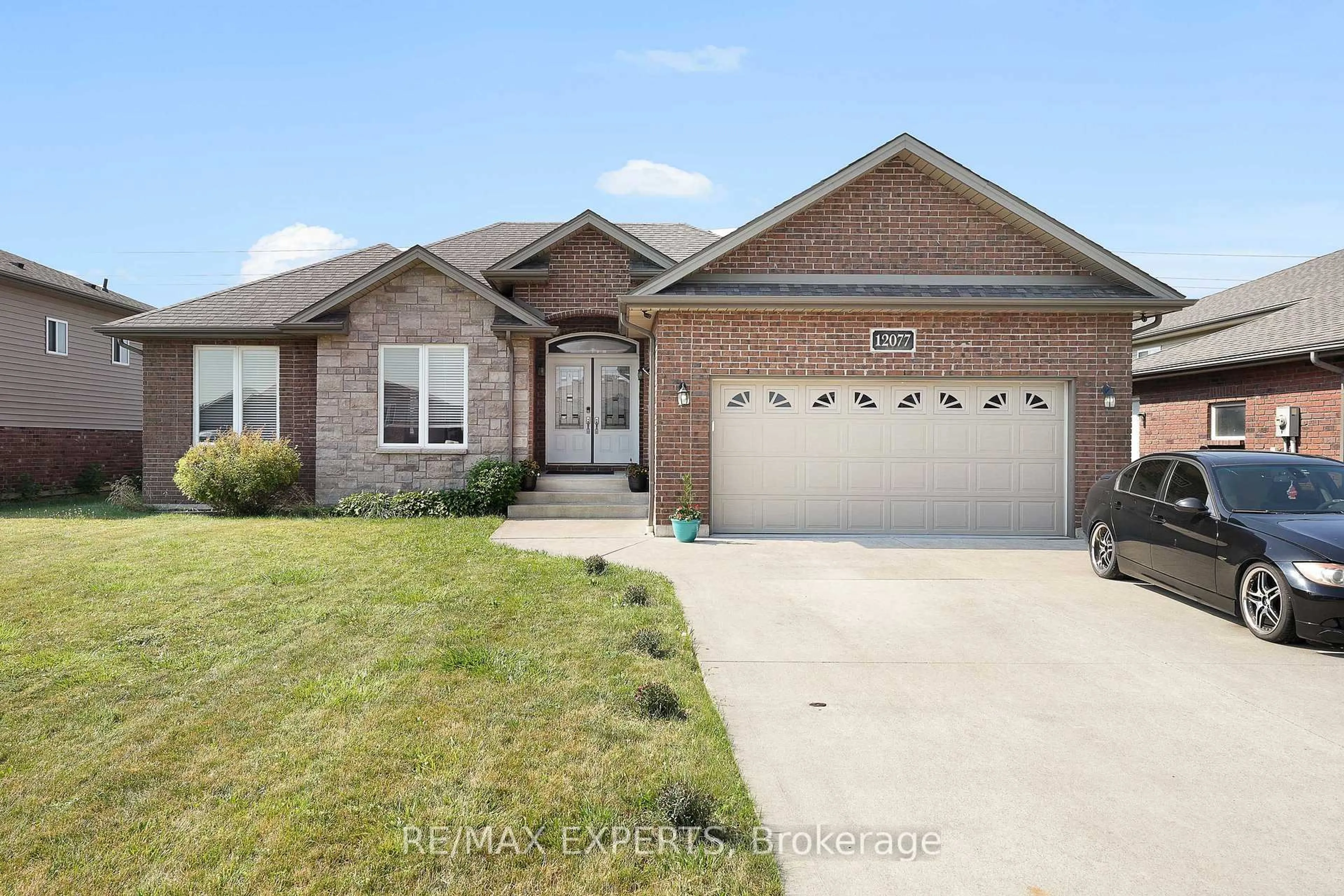 Home with brick exterior material, street for 12077 Ducharme Lane, Essex Ontario N0R 1J0