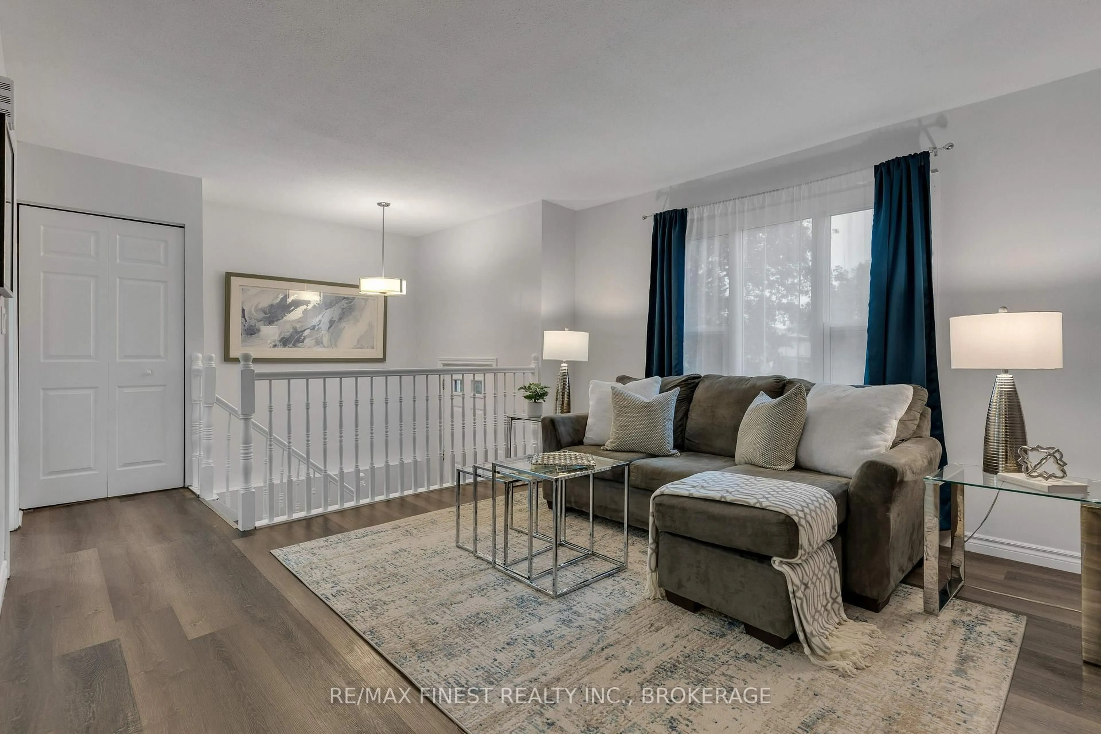 Living room with furniture, wood/laminate floor for 952 Old Colony Rd, Kingston Ontario K7P 1J7