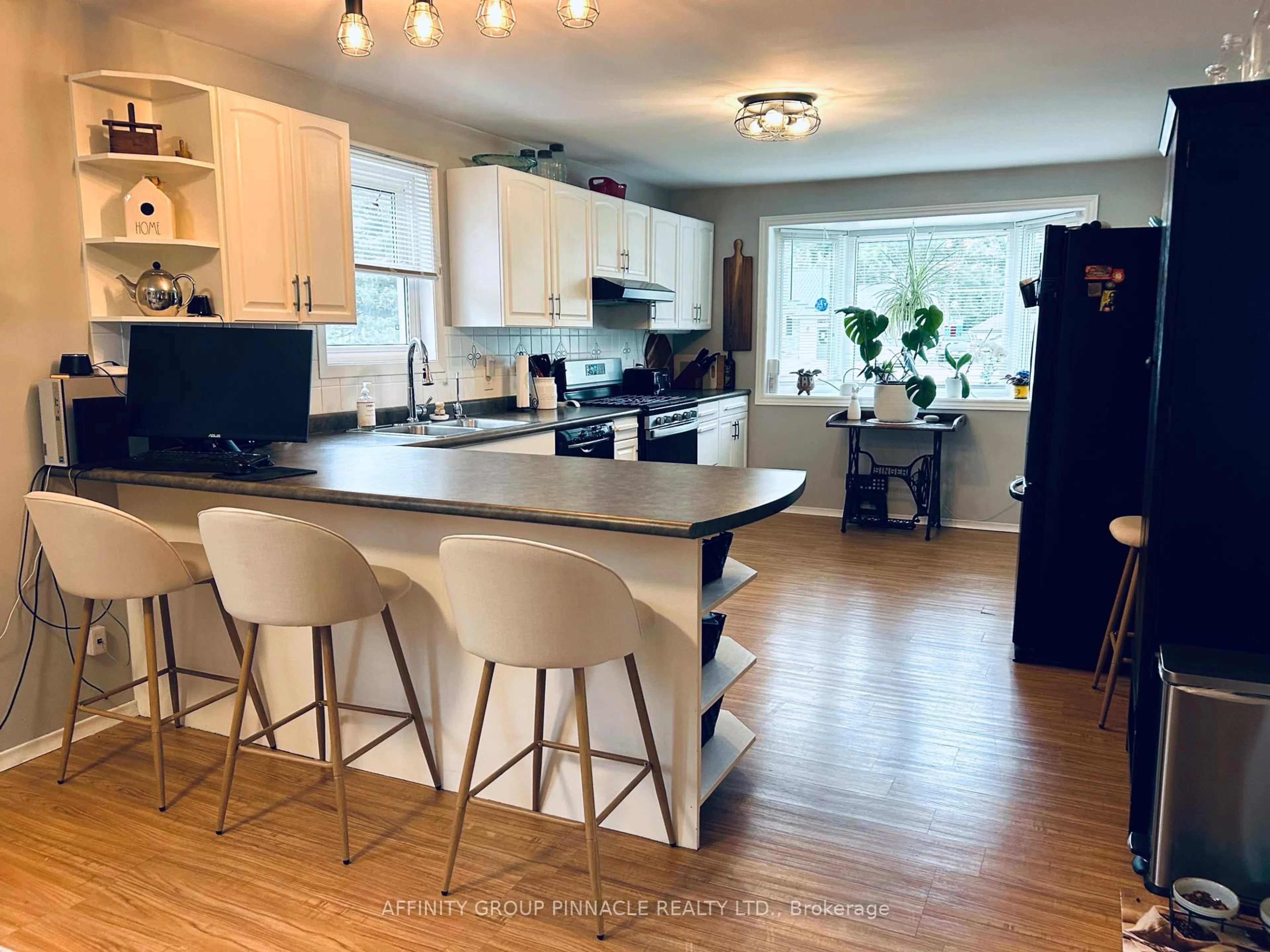 Open concept kitchen, wood/laminate floor for 97 Bolsover Rd, Kawartha Lakes Ontario K0M 2T0