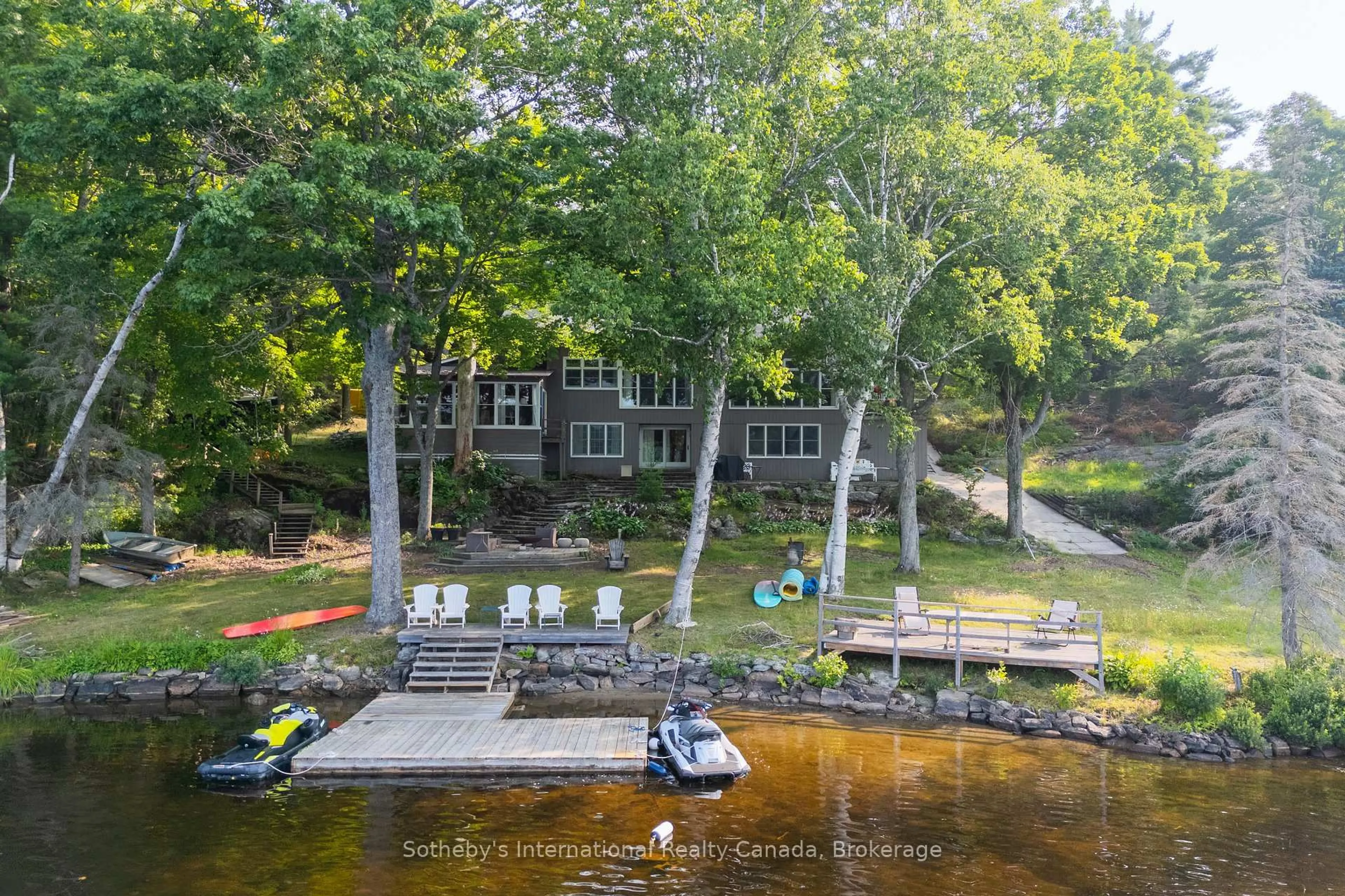 A pic from outside/outdoor area/front of a property/back of a property/a pic from drone, water/lake/river/ocean view for 1154 Ridge Rd, Muskoka Lakes Ontario P0C 1M0