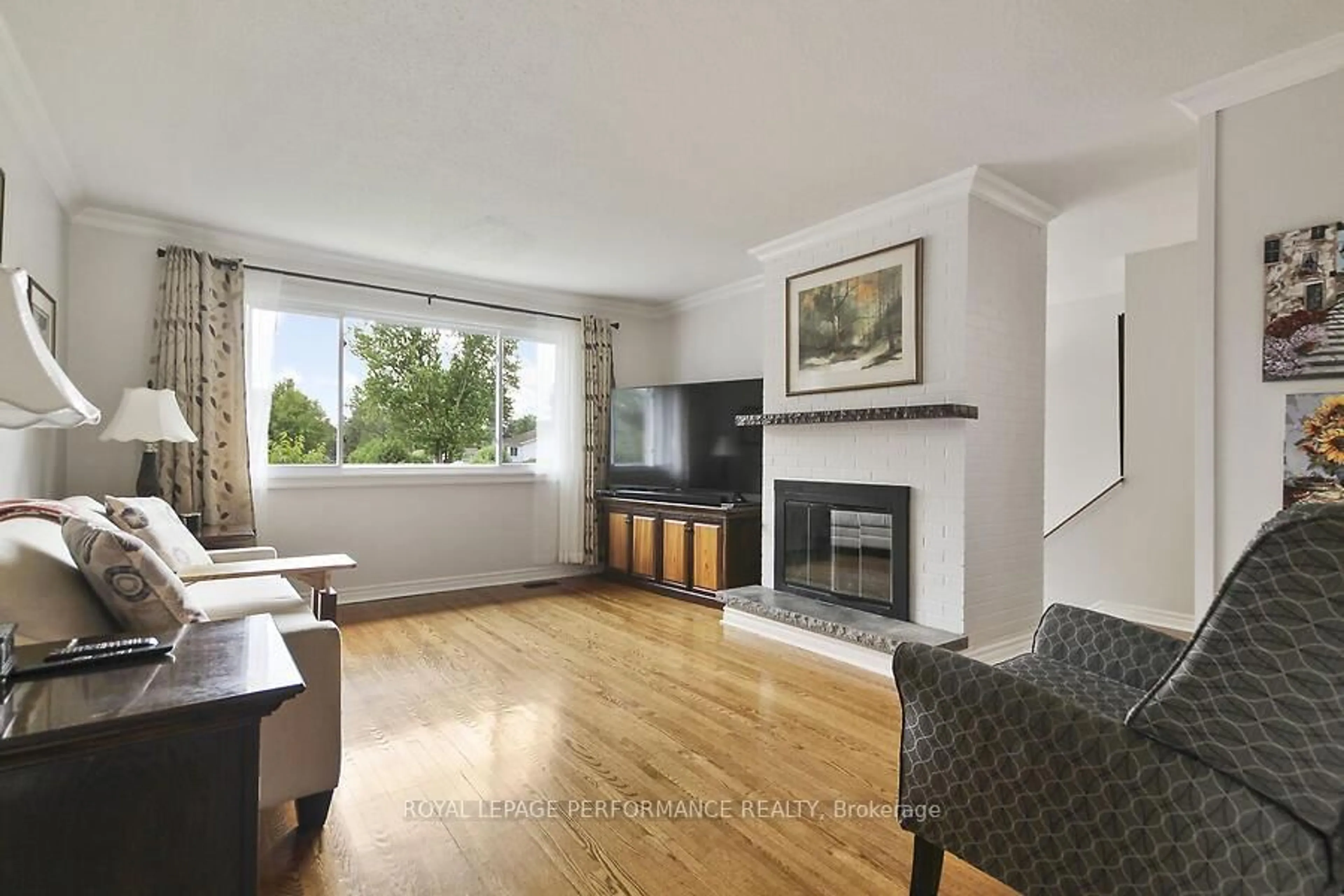 Living room with furniture, wood/laminate floor for 141 Abbotsford Rd, Kanata Ontario K2L 1C6