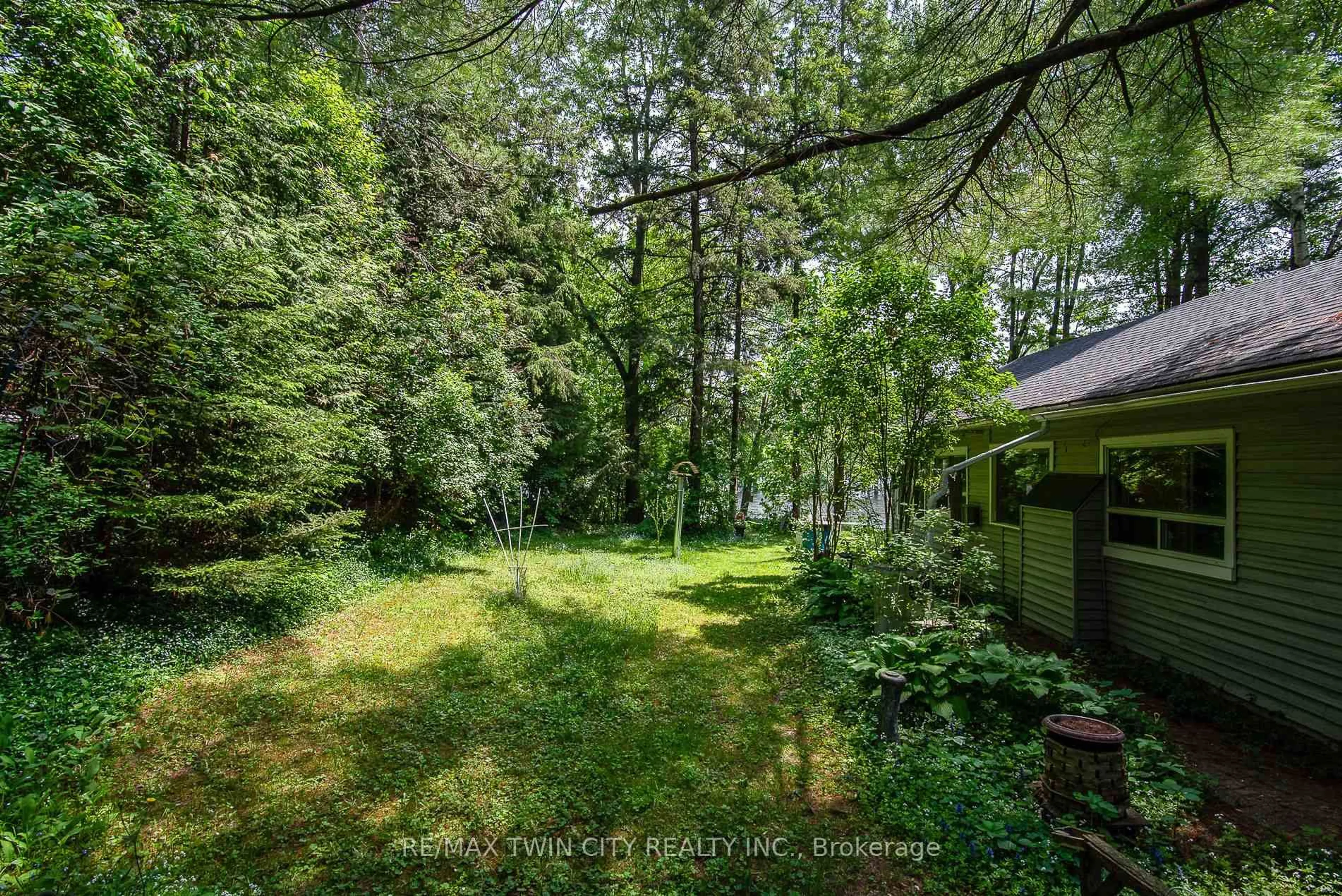 A pic from outside/outdoor area/front of a property/back of a property/a pic from drone, forest/trees view for 1002 Tenth St, Centre Wellington Ontario N0B 1J0
