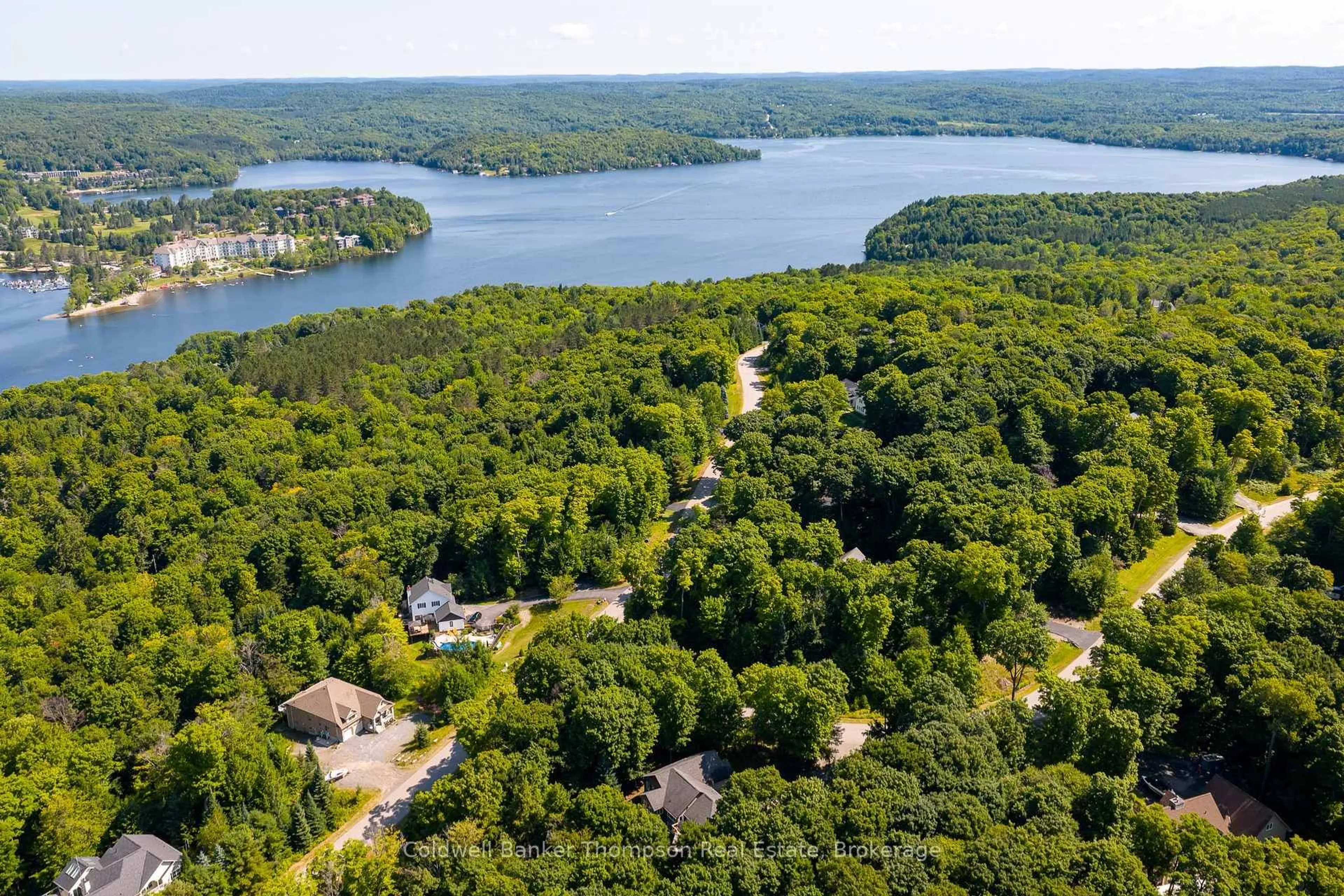 A pic from outside/outdoor area/front of a property/back of a property/a pic from drone, water/lake/river/ocean view for 1 Birchwood Dr, Huntsville Ontario P1H 0A6