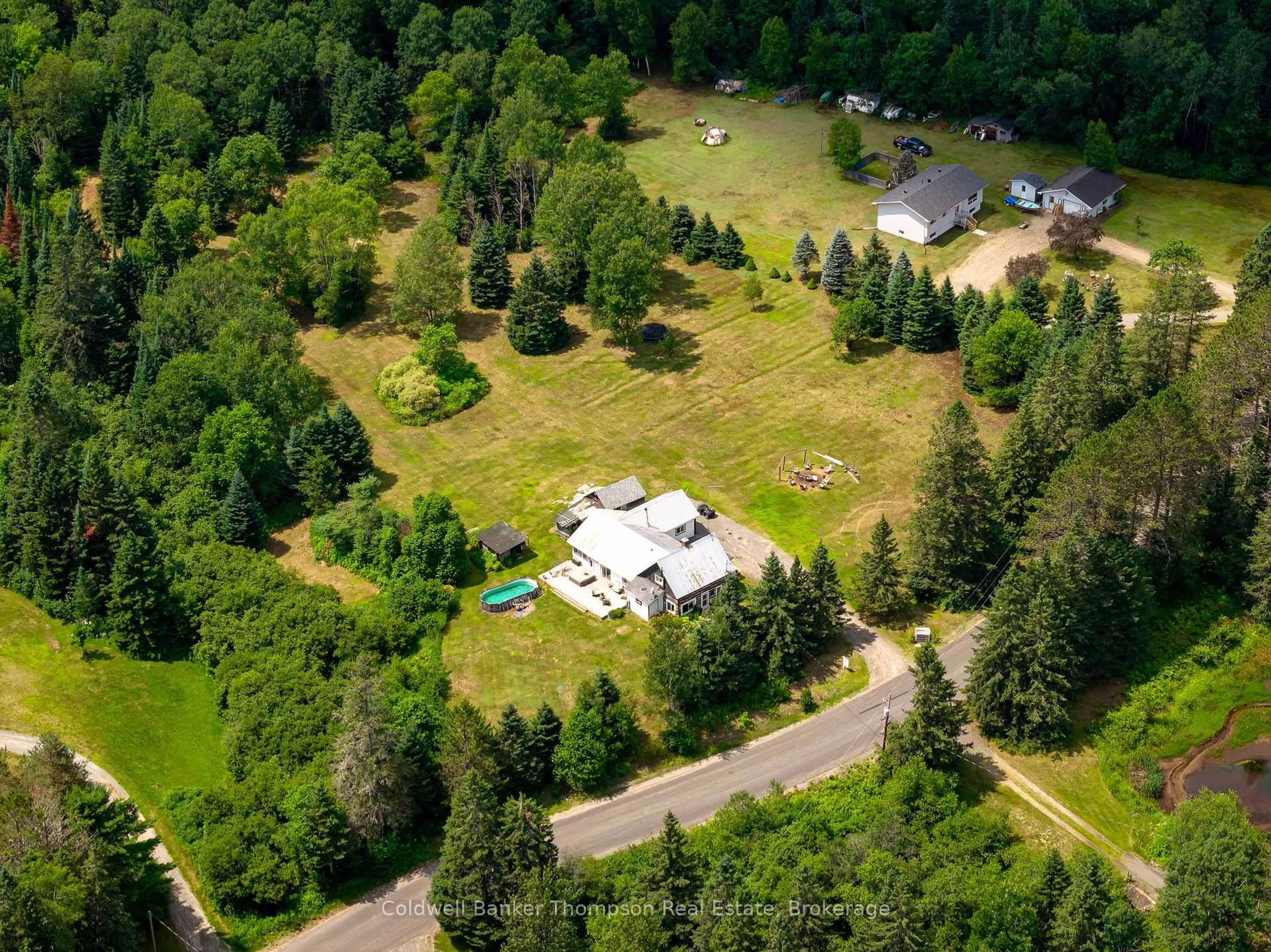 A pic from outside/outdoor area/front of a property/back of a property/a pic from drone, forest/trees view for 1516 Williamsport Rd, Huntsville Ontario P1H 2J4
