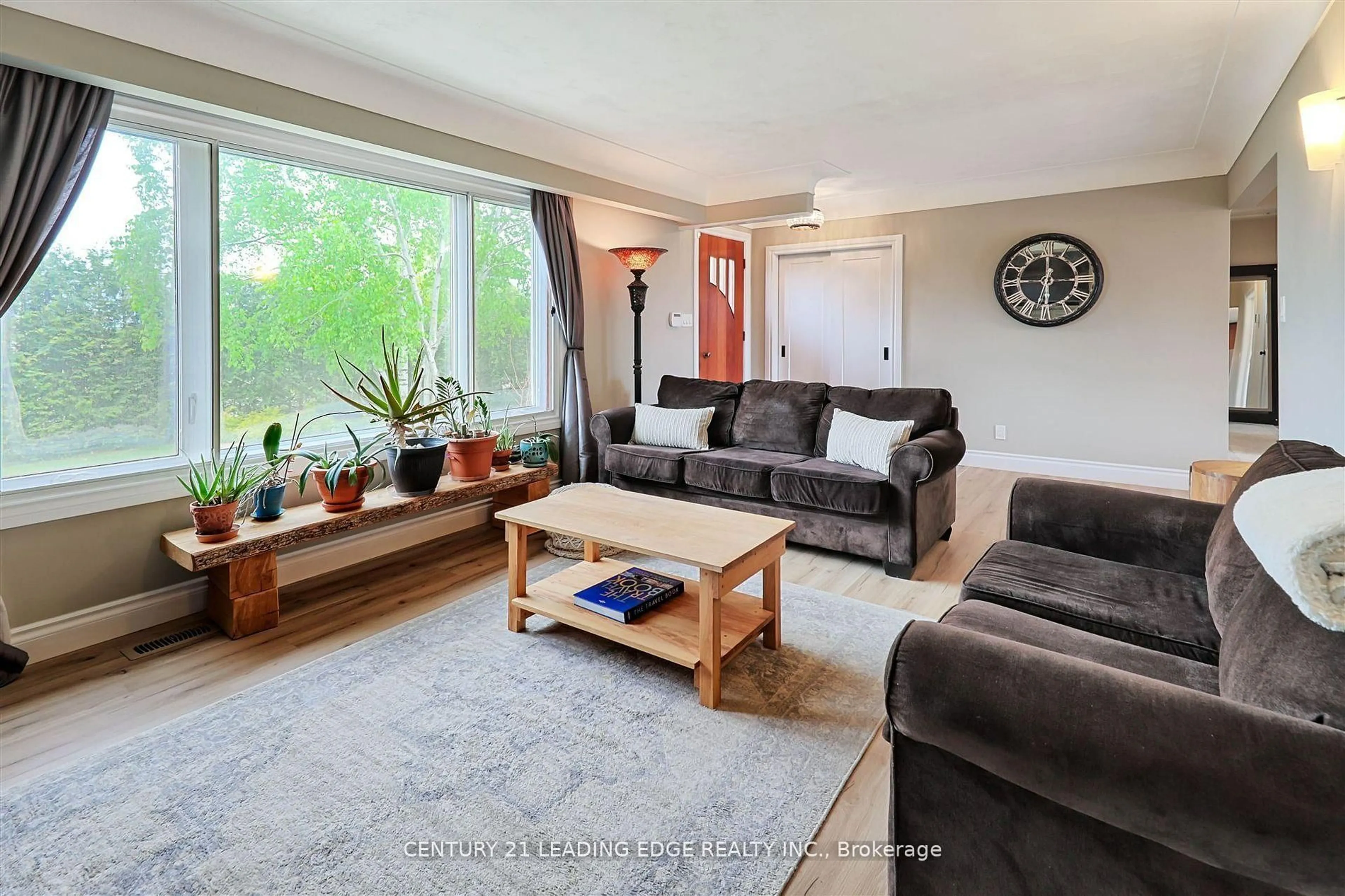 Living room with furniture, wood/laminate floor for 8276 White Church Rd, Hamilton Ontario L0R 1W0