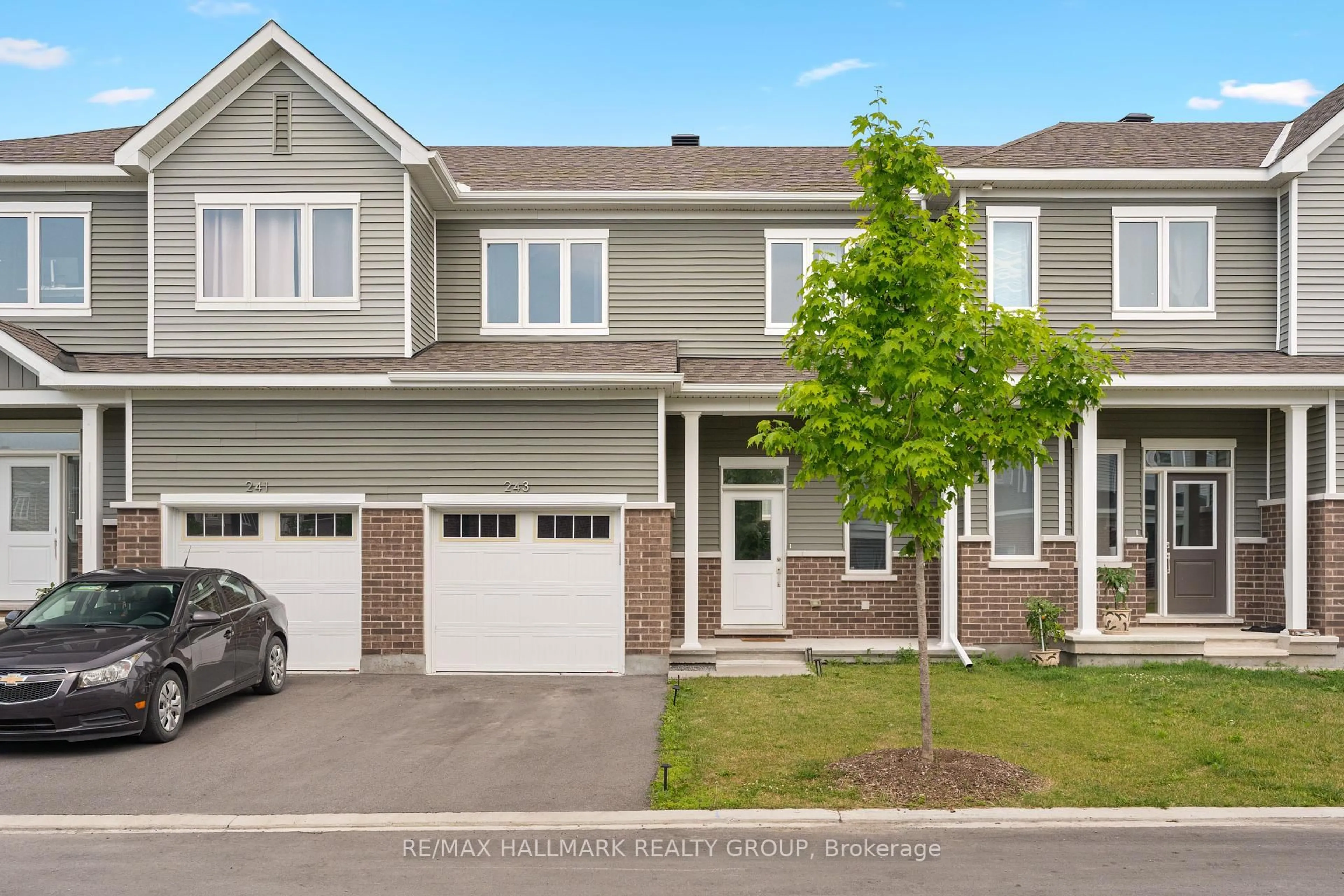 Home with vinyl exterior material, street for 243 Surface Lane, Ottawa Ontario K2J 6X9
