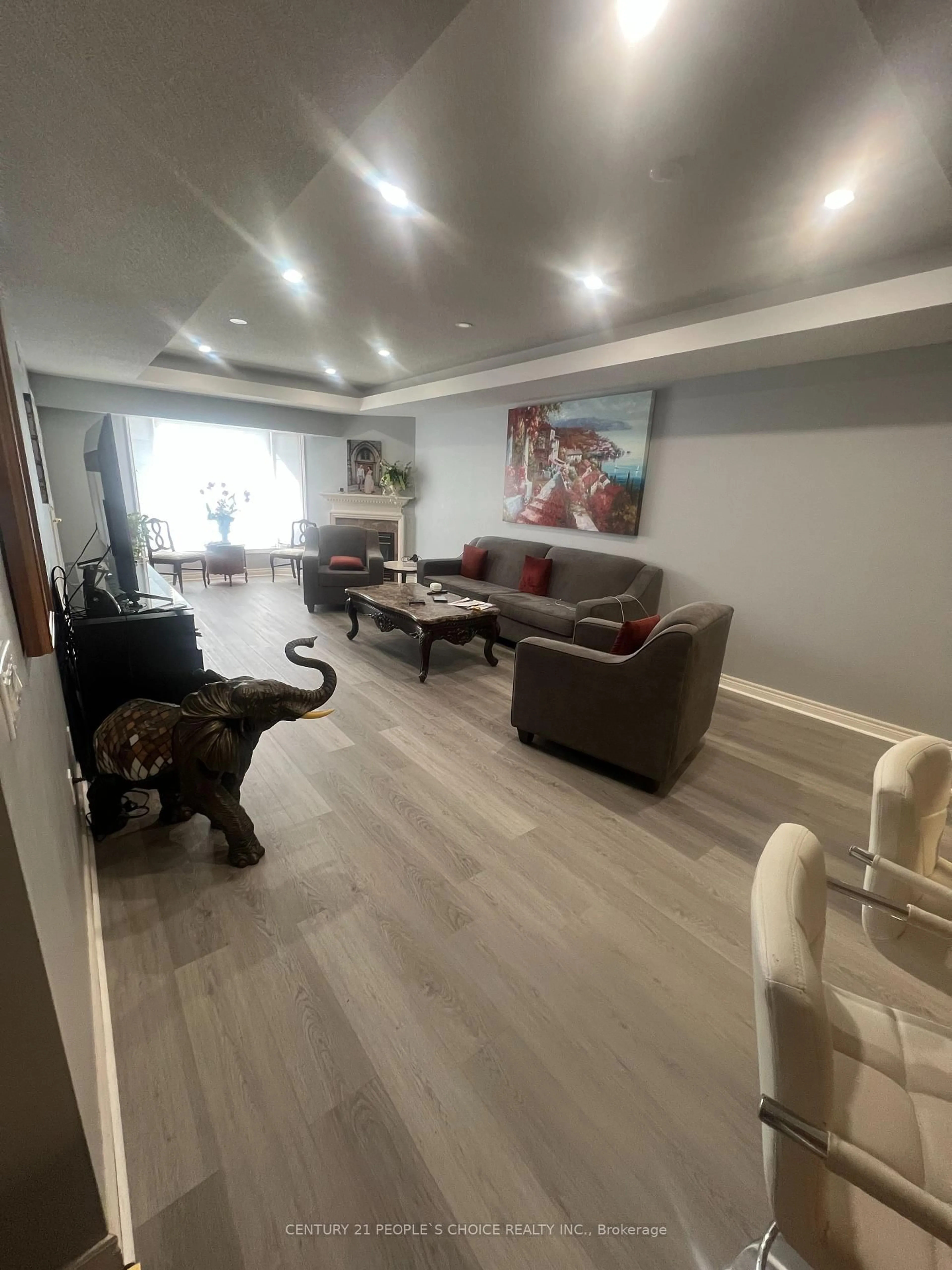 Living room with furniture, wood/laminate floor for 990 Golf Links Rd #308, Hamilton Ontario L9K 1J8
