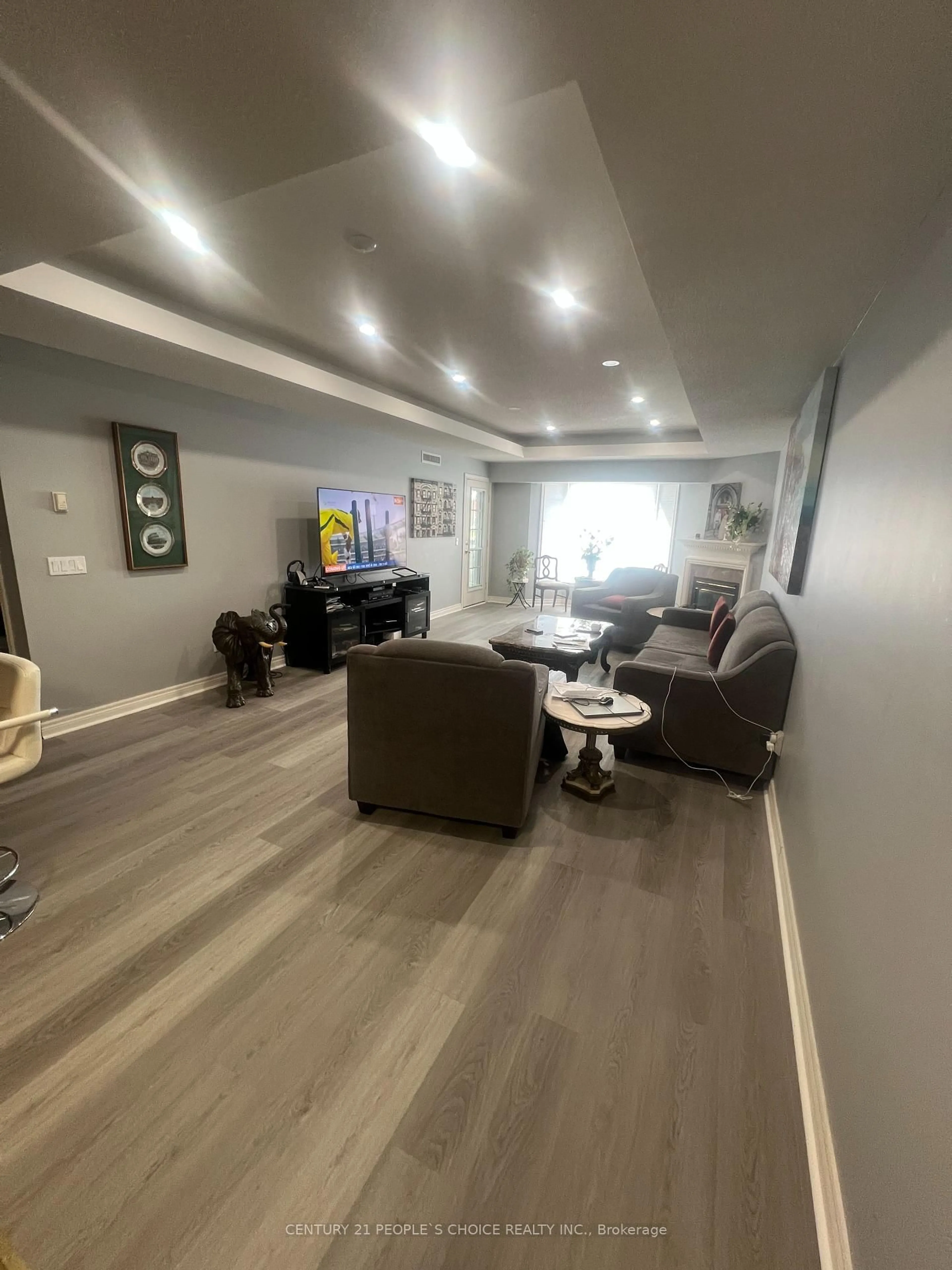 Living room with furniture, wood/laminate floor for 990 Golf Links Rd #308, Hamilton Ontario L9K 1J8