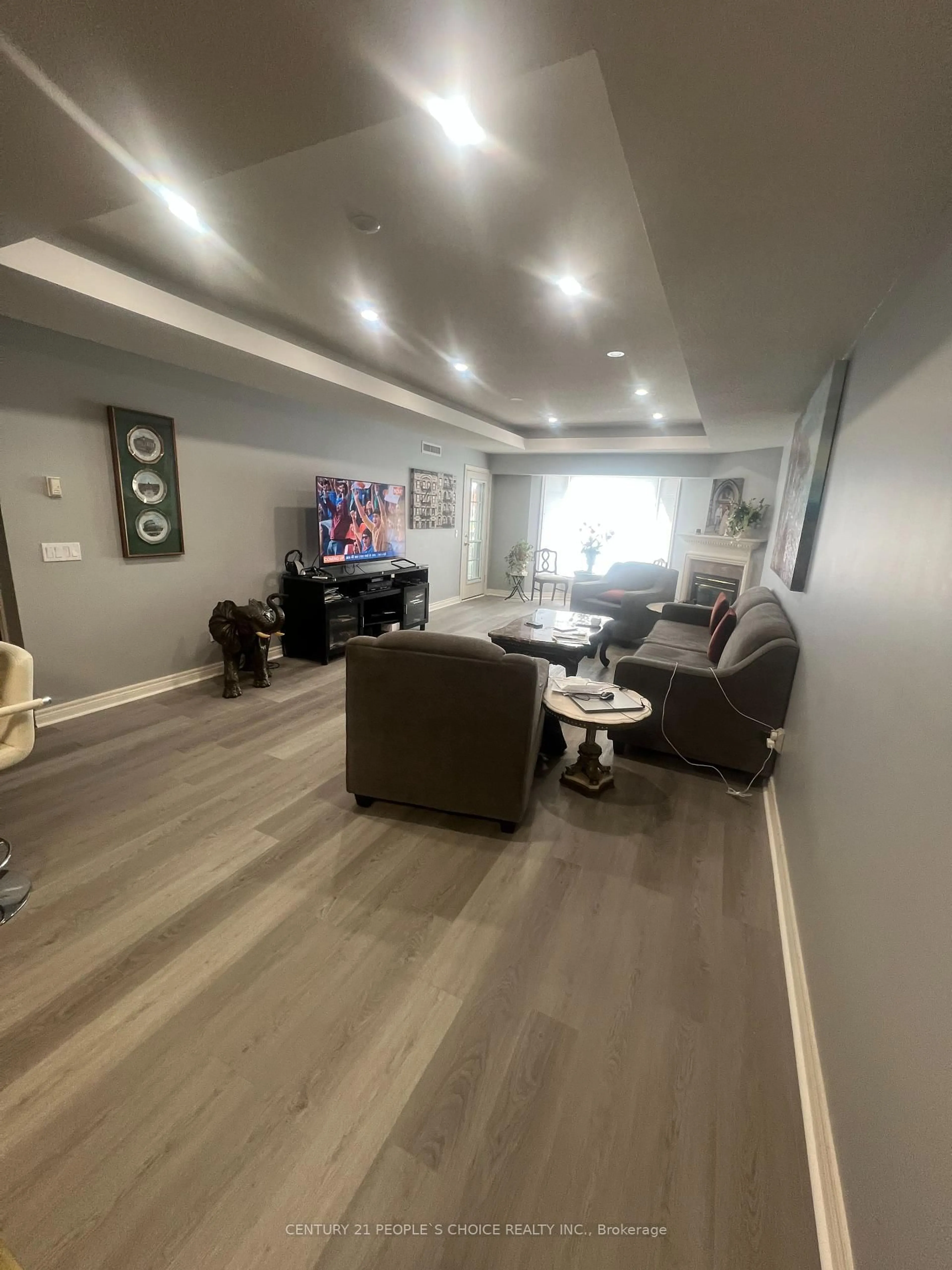 Living room with furniture, wood/laminate floor for 990 Golf Links Rd #308, Hamilton Ontario L9K 1J8