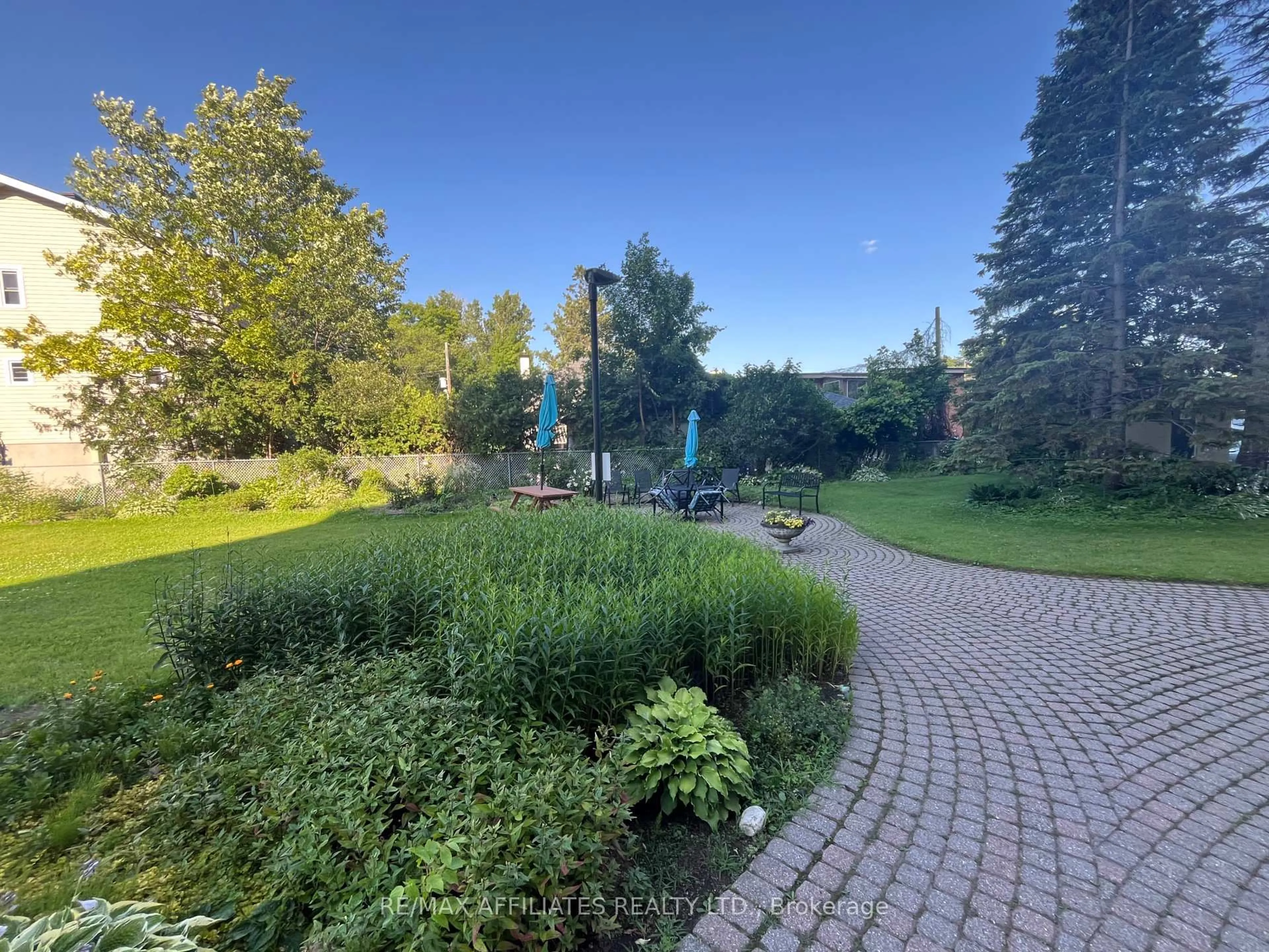 A pic from outside/outdoor area/front of a property/back of a property/a pic from drone, forest/trees view for 555 BRITTANY Dr #407, Ottawa Ontario K1K 4C5
