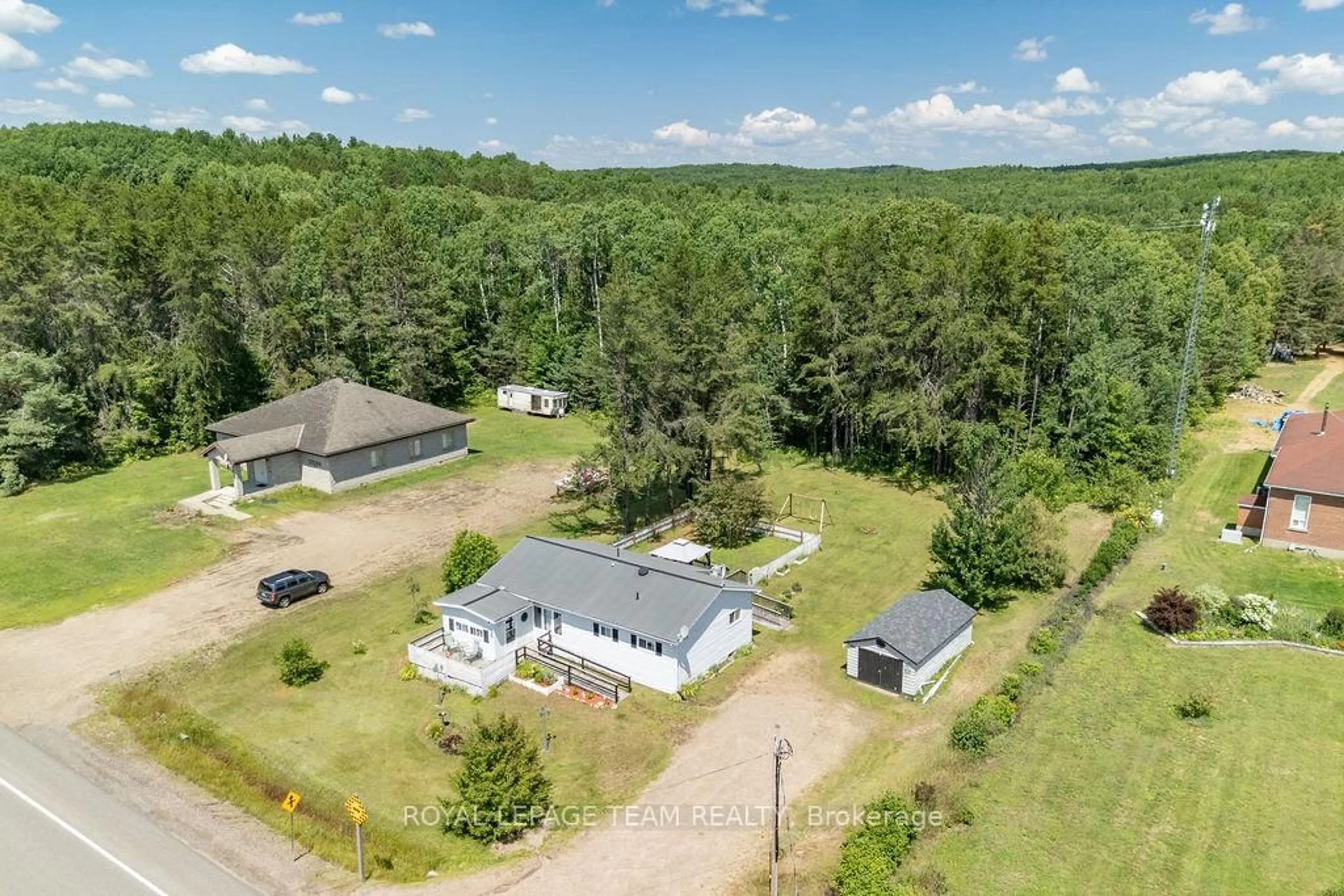 A pic from outside/outdoor area/front of a property/back of a property/a pic from drone, unknown for 25280 Highway 60 Highway, South Algonquin Ontario K0J 2C0