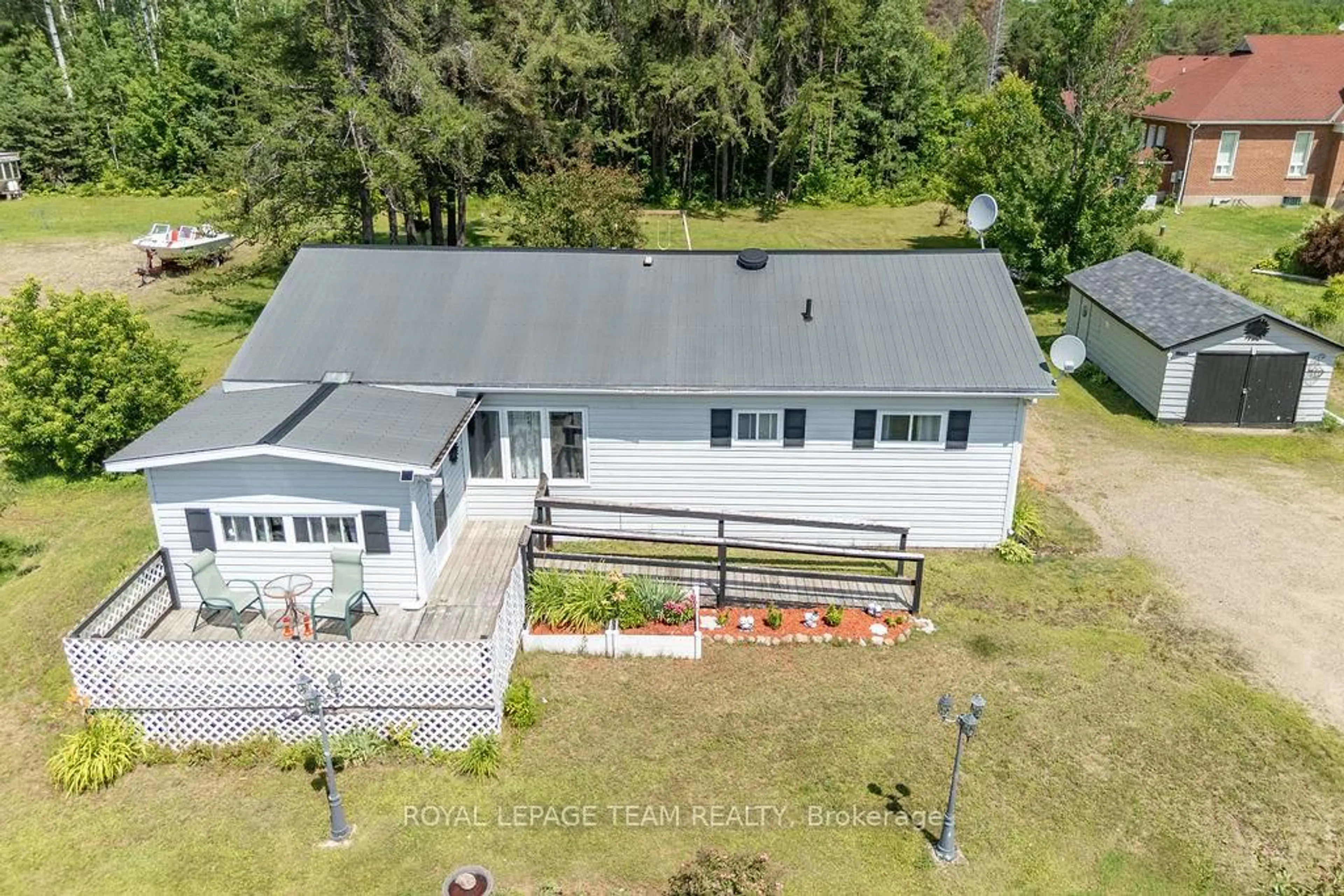 A pic from outside/outdoor area/front of a property/back of a property/a pic from drone, water/lake/river/ocean view for 25280 Highway 60 Highway, South Algonquin Ontario K0J 2C0