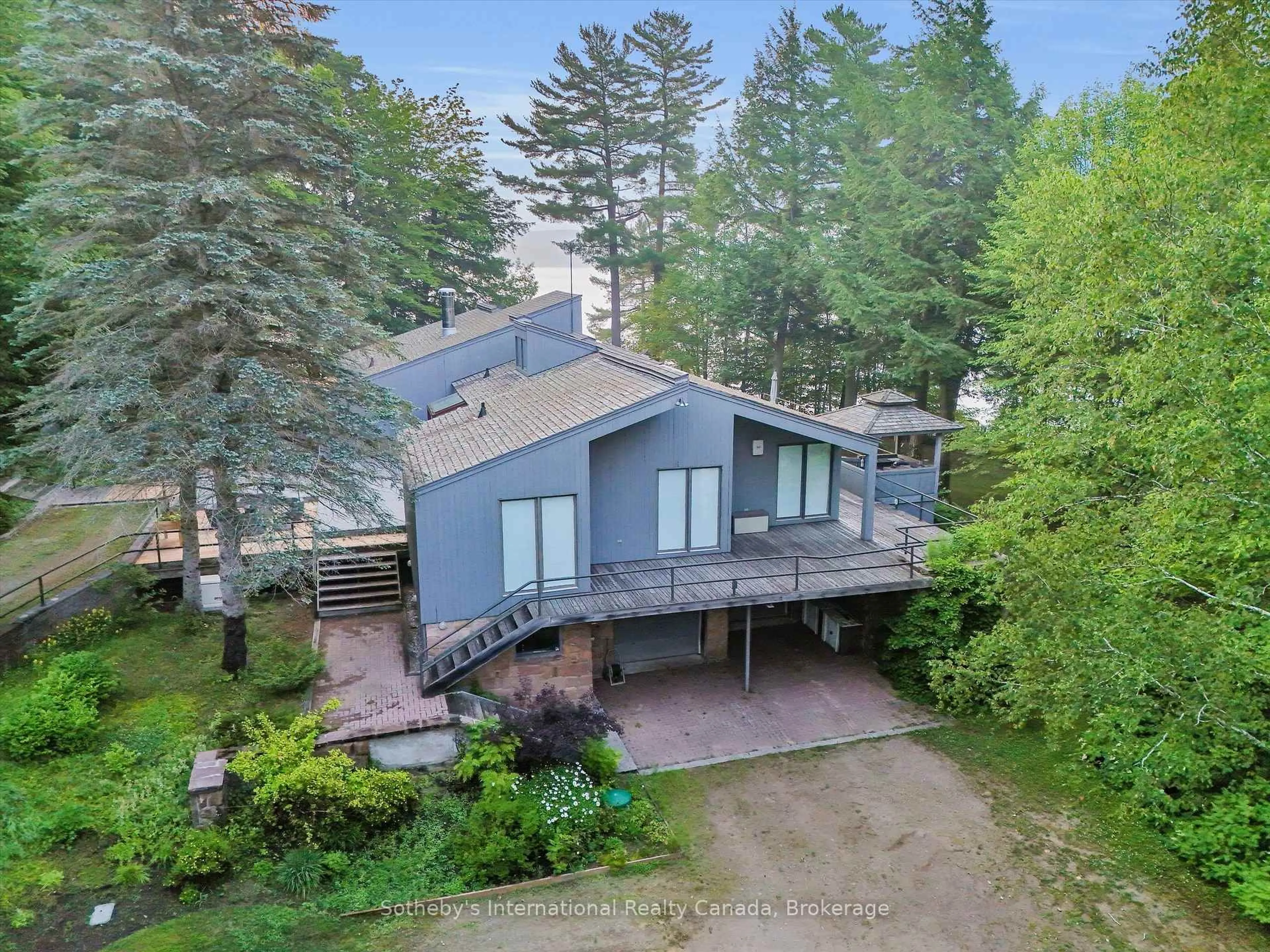 A pic from outside/outdoor area/front of a property/back of a property/a pic from drone, forest/trees view for 1080 Vanclieaf Dr, Lake of Bays Ontario P0B 1A0