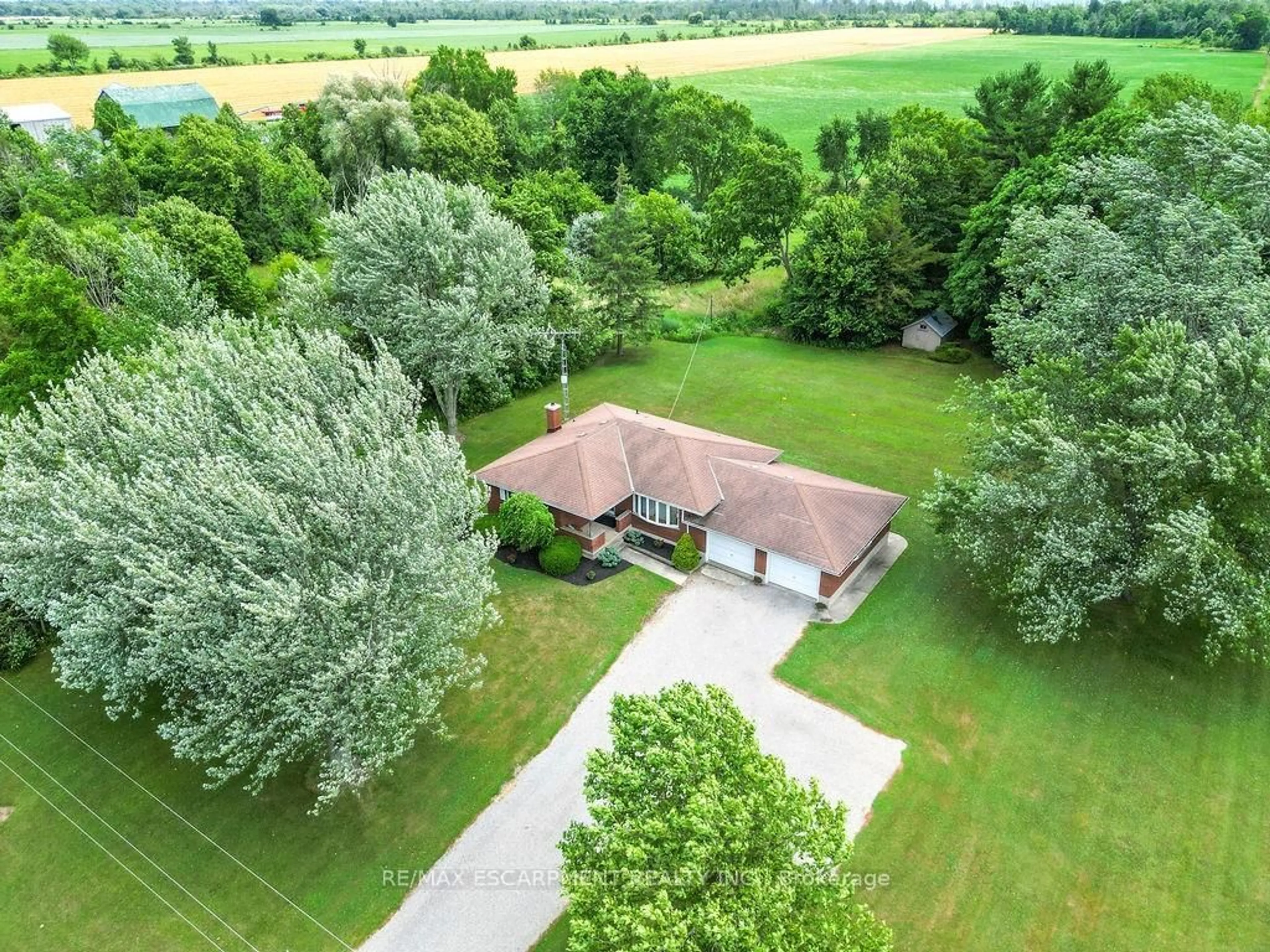 A pic from outside/outdoor area/front of a property/back of a property/a pic from drone, forest/trees view for 881 Kings Row, Haldimand Ontario N1A 2W8