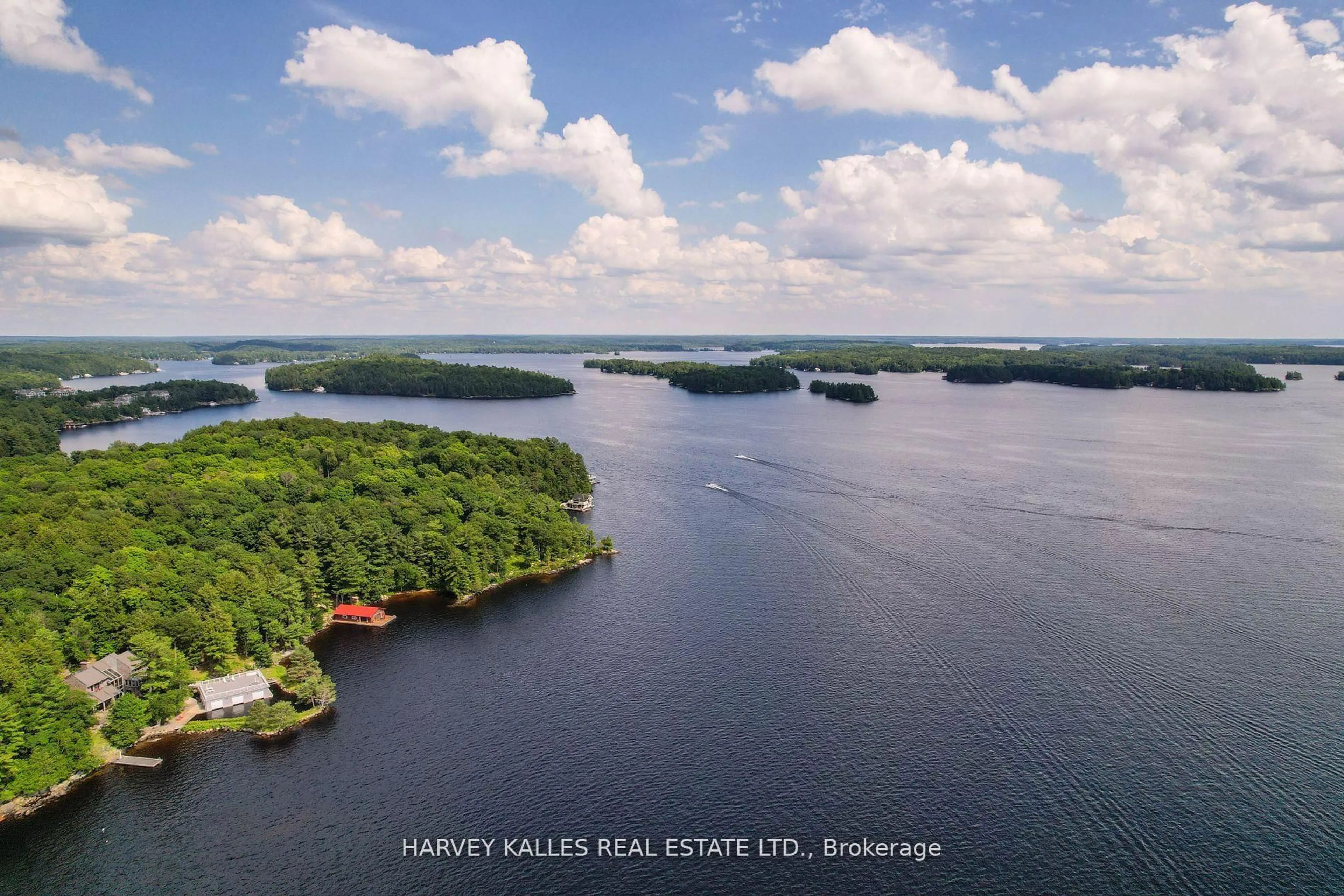 A pic from outside/outdoor area/front of a property/back of a property/a pic from drone, water/lake/river/ocean view for 2045 Muskoka Rd 118W #Unit 2, Muskoka Lakes Ontario P1L 1W8