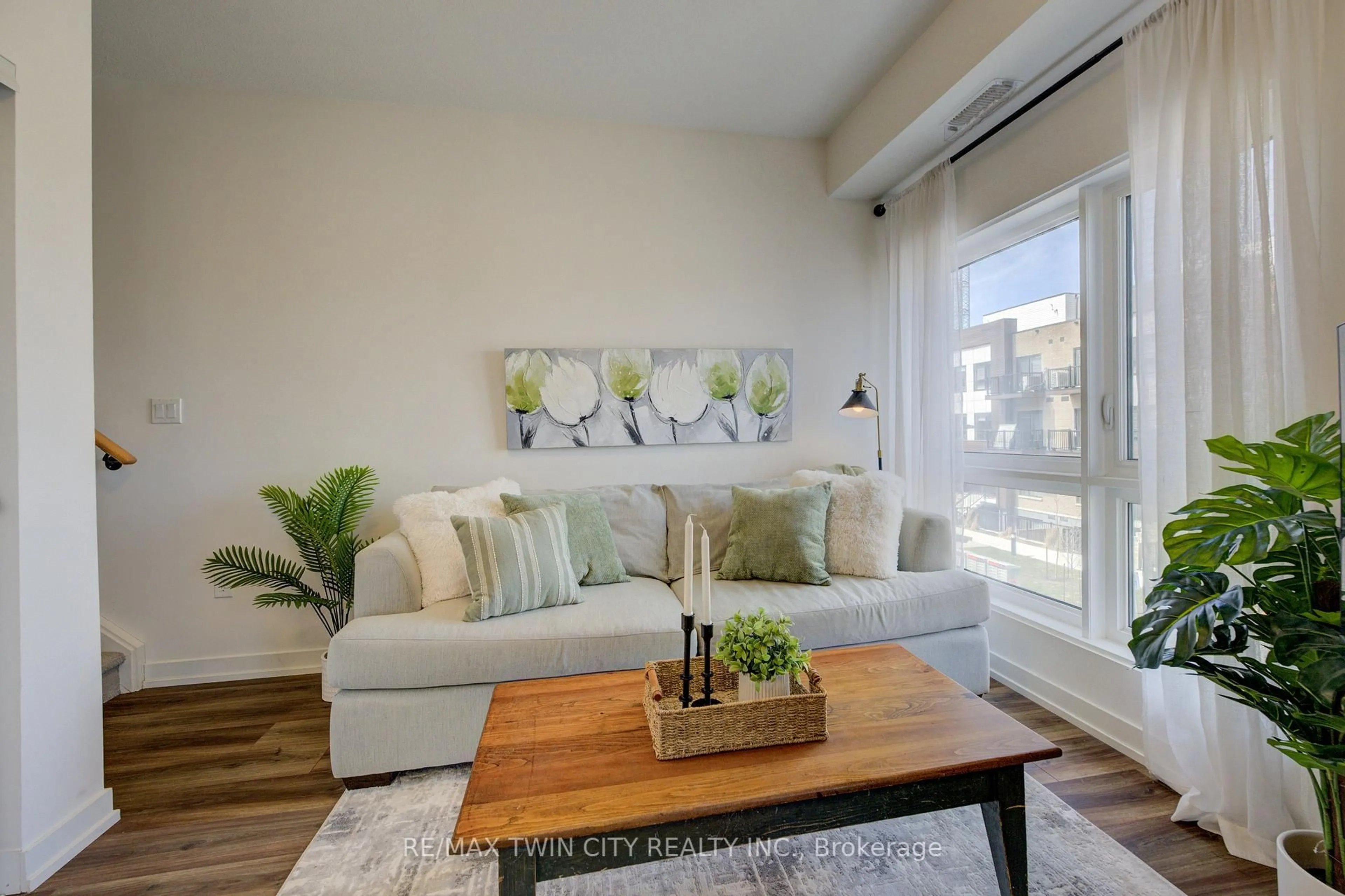 Living room with furniture, wood/laminate floor for 20 Palace St #F11, Kitchener Ontario N2E 0J3