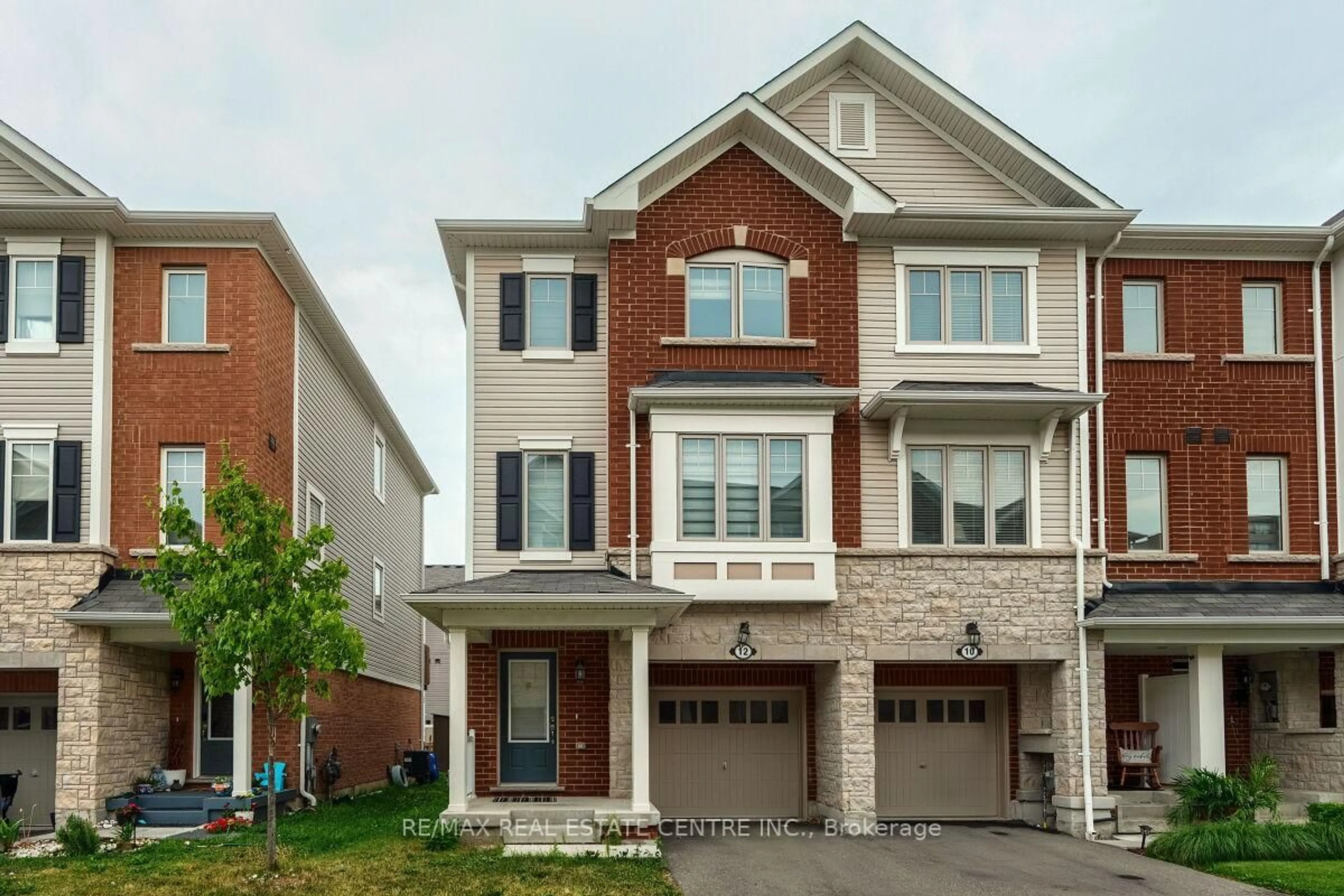 Home with brick exterior material, street for 12 Rapids Lane, Hamilton Ontario L8K 0A3
