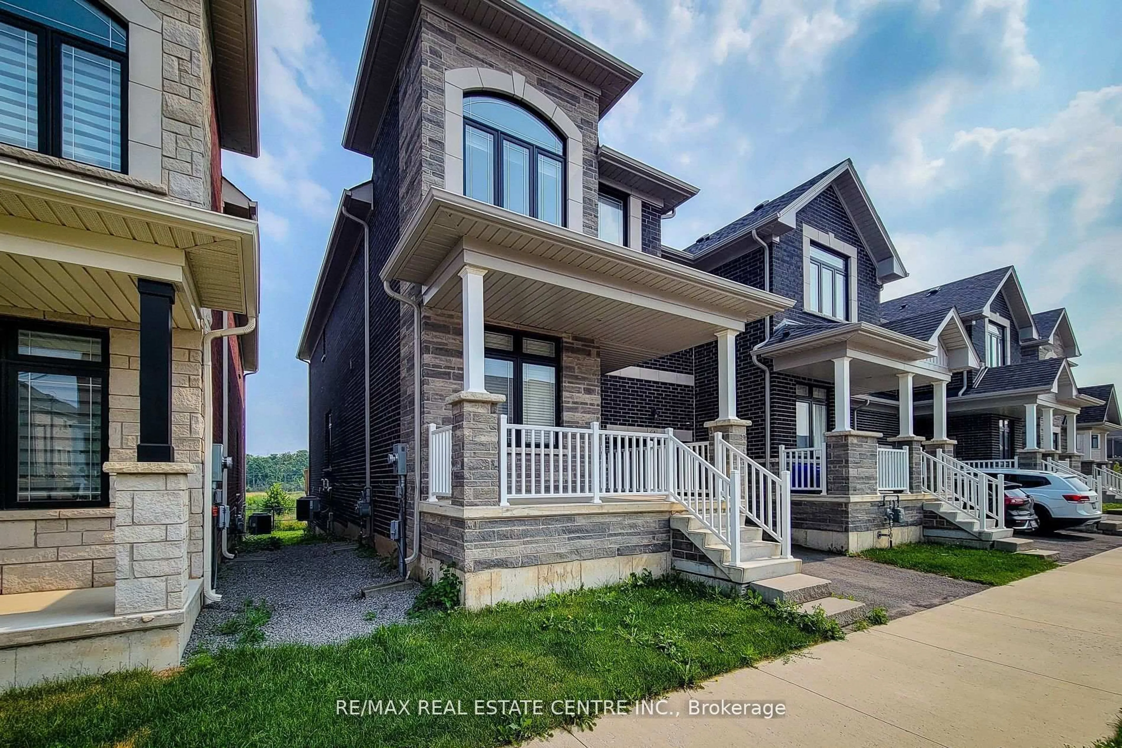 Home with brick exterior material, street for 64 Great Falls Blvd, Hamilton Ontario L8B 1Y5