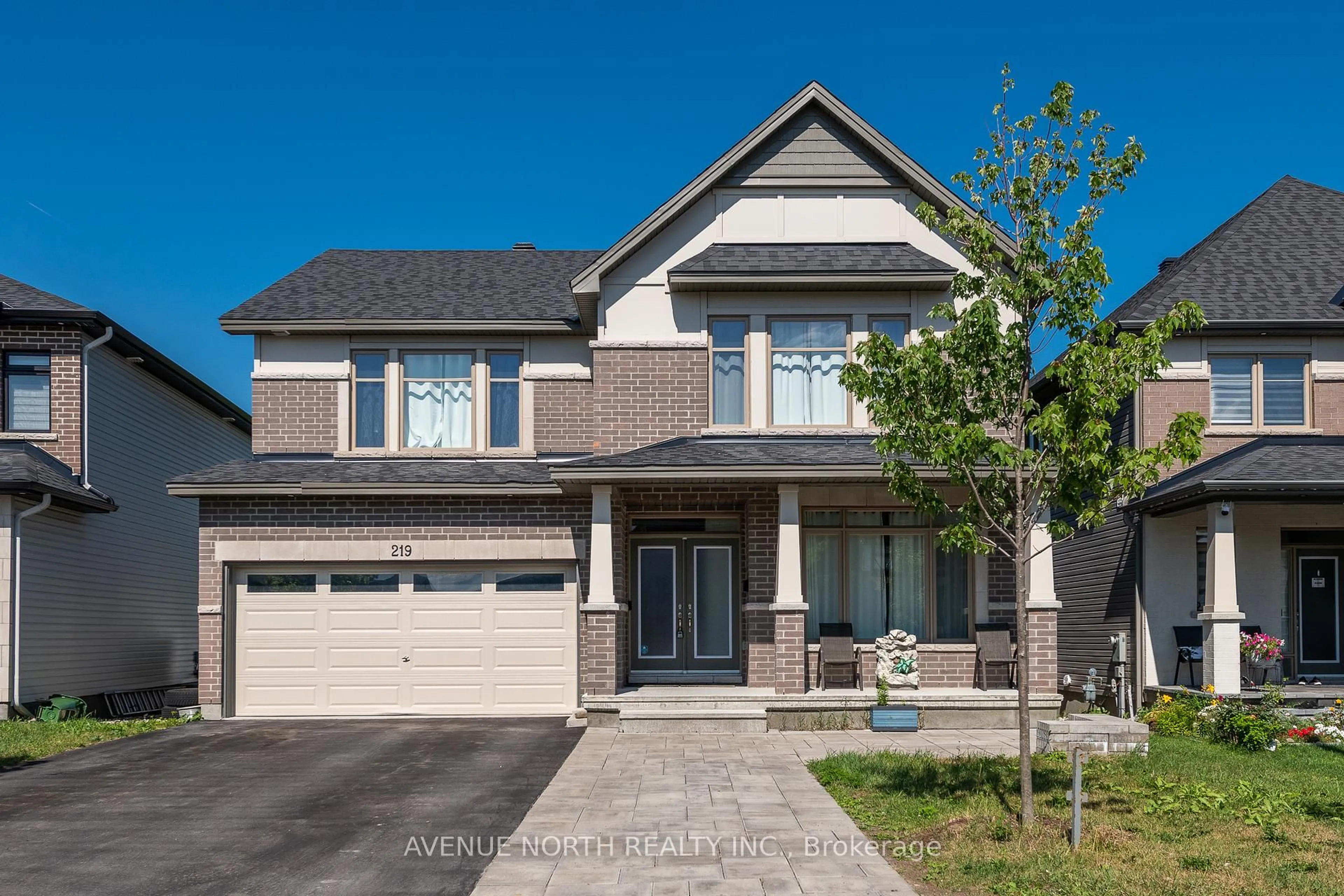 Home with brick exterior material, street for 219 Reisling Way, Ottawa Ontario K1T 0X1