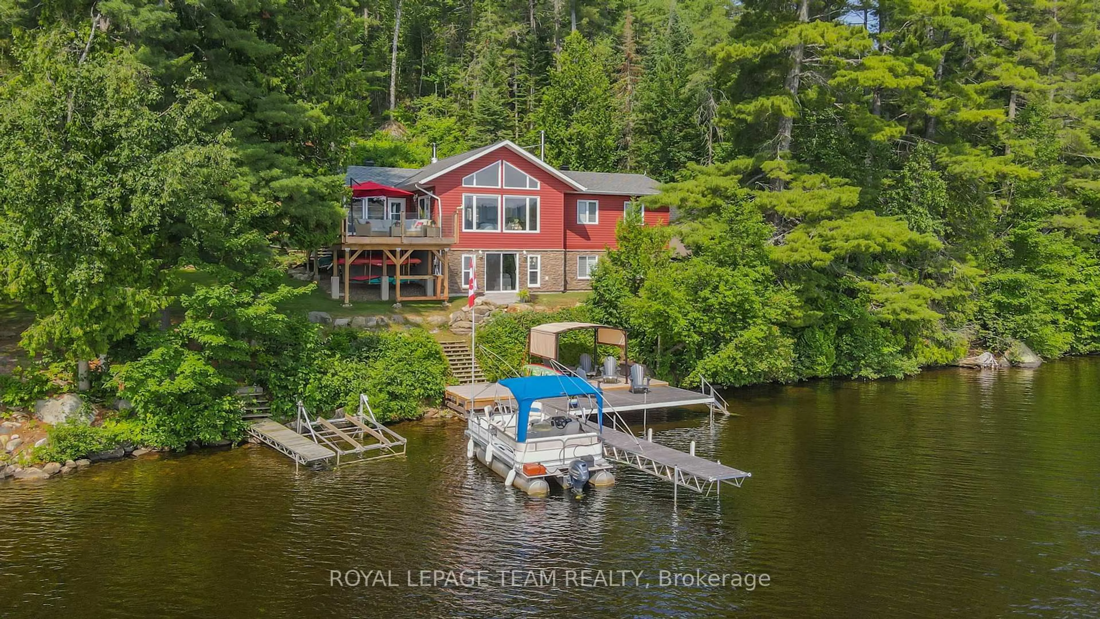 A pic from outside/outdoor area/front of a property/back of a property/a pic from drone, water/lake/river/ocean view for 34 Moose Track Lane, South Algonquin Ontario K0J 2C0