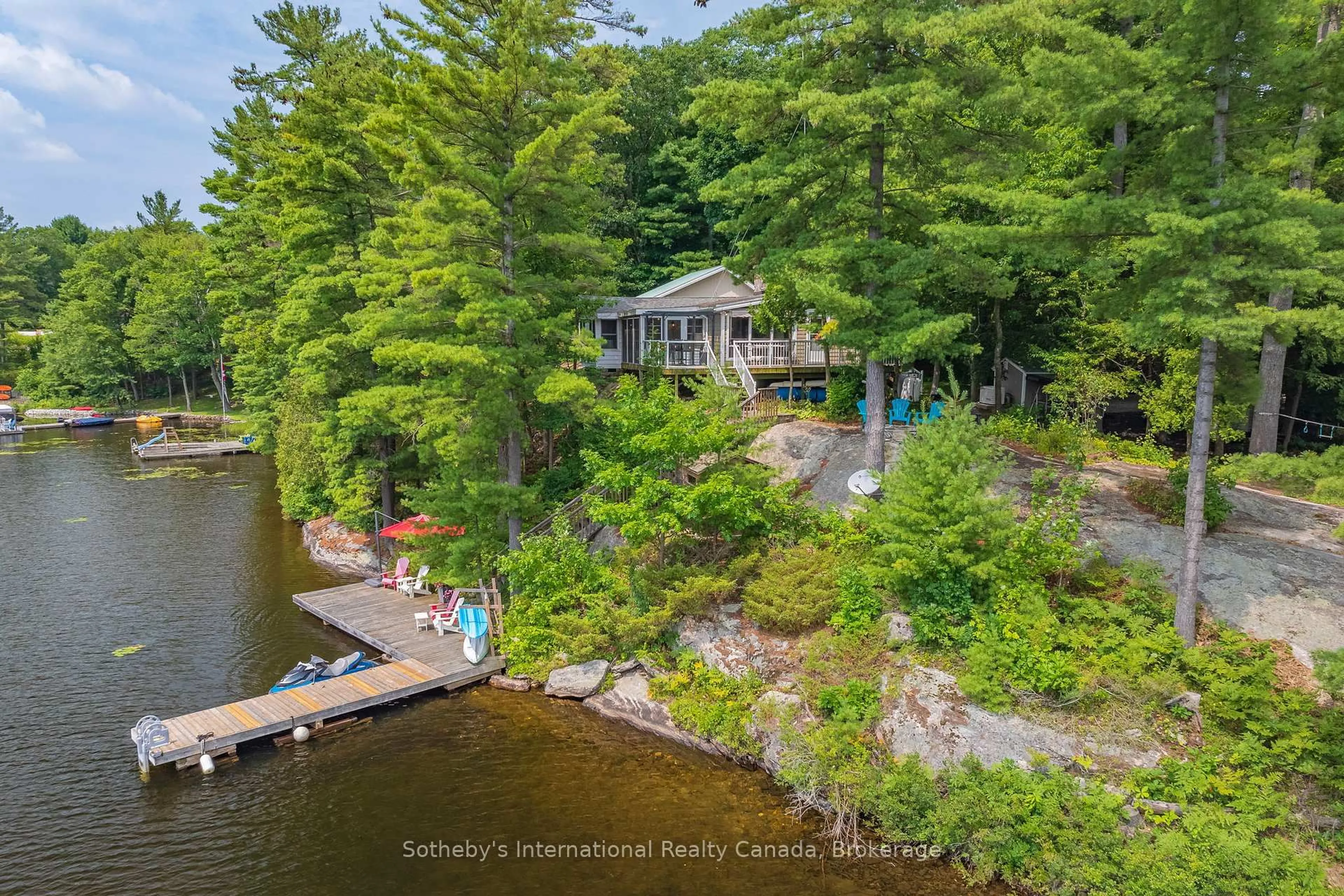 A pic from outside/outdoor area/front of a property/back of a property/a pic from drone, water/lake/river/ocean view for 1032 Sunset Bay Rd, Gravenhurst Ontario P1P 1R2