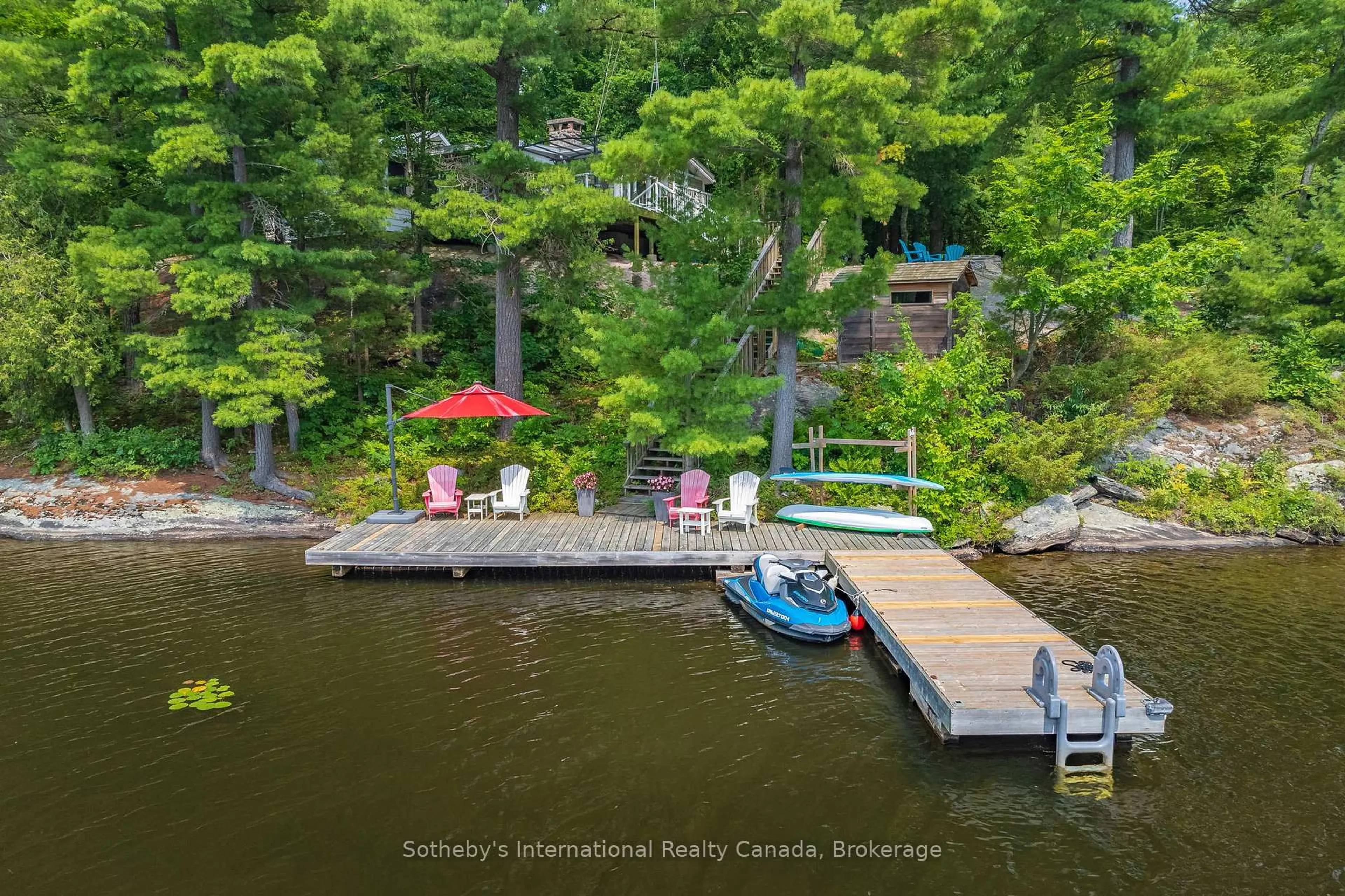 A pic from outside/outdoor area/front of a property/back of a property/a pic from drone, water/lake/river/ocean view for 1032 Sunset Bay Rd, Gravenhurst Ontario P1P 1R2