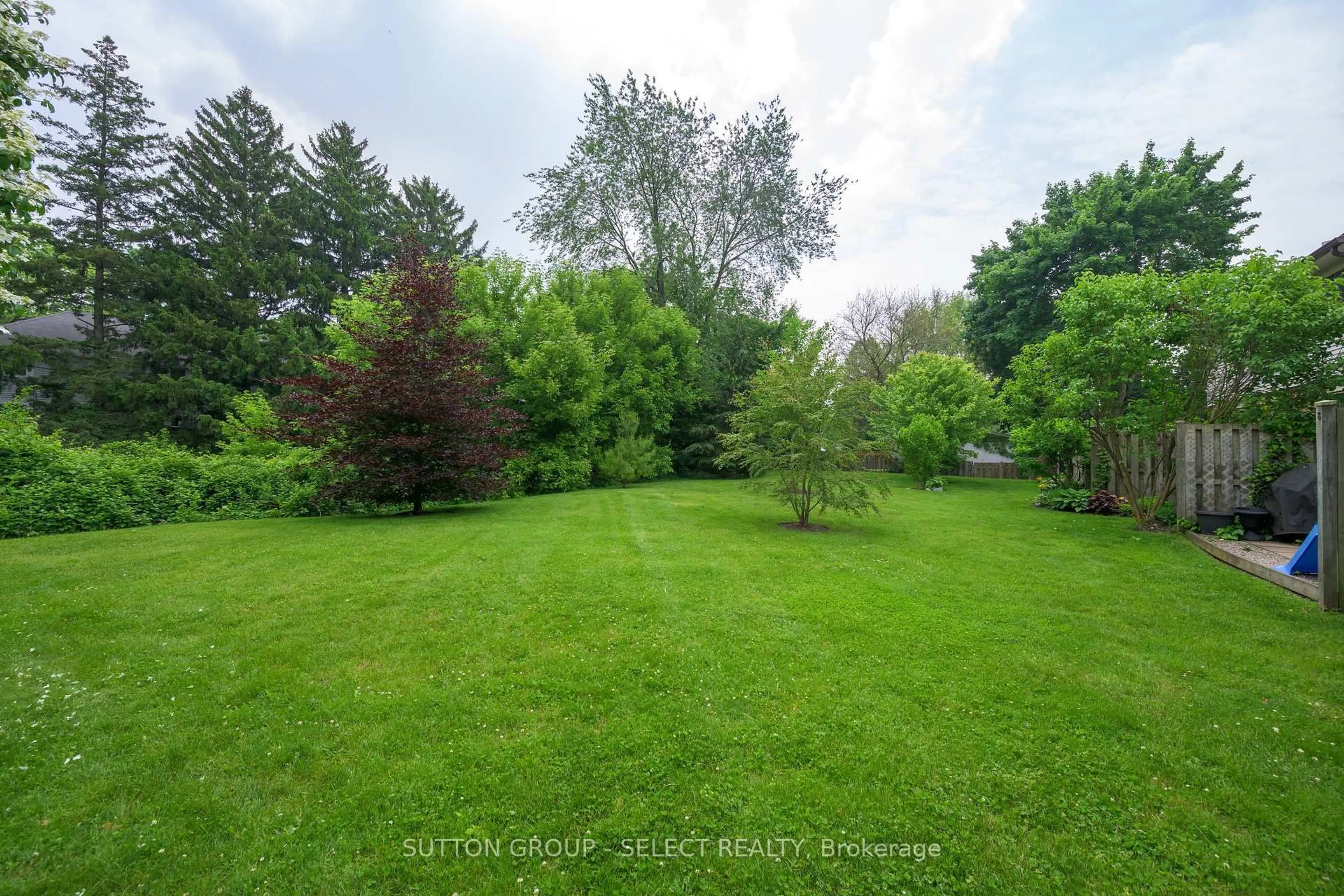 A pic from outside/outdoor area/front of a property/back of a property/a pic from drone, forest/trees view for 1328 Commissioners Rd #102, London South Ontario N6K 2Y6