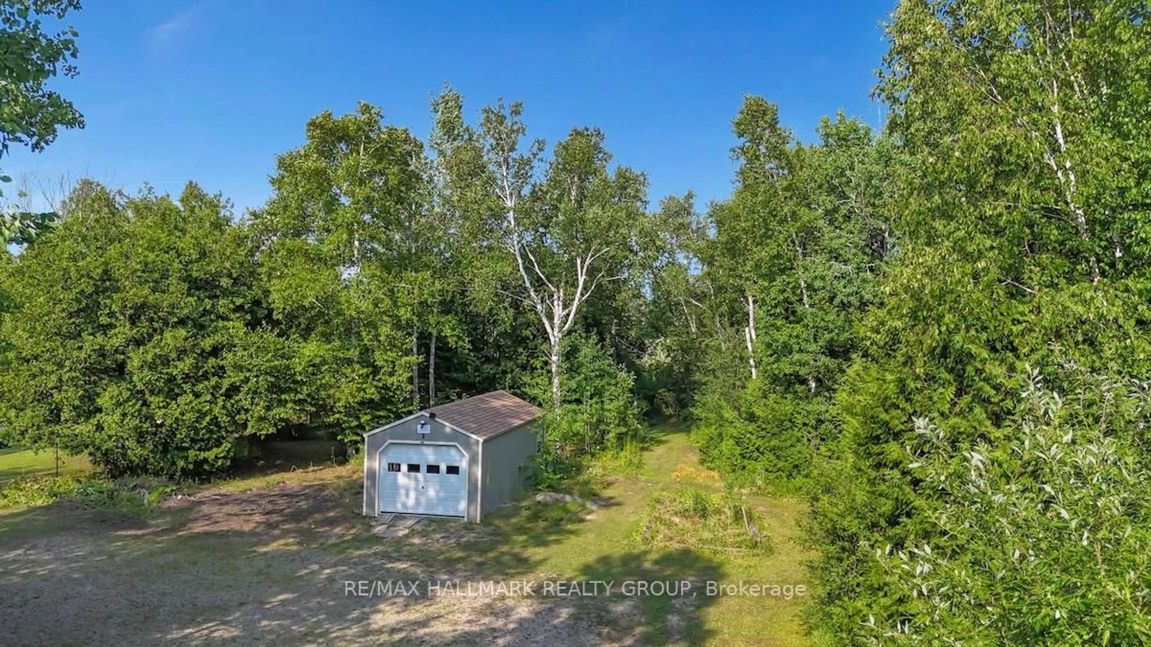 A pic from outside/outdoor area/front of a property/back of a property/a pic from drone, forest/trees view for 6 Birch Lane, Rideau Lakes Ontario K7A 5B8