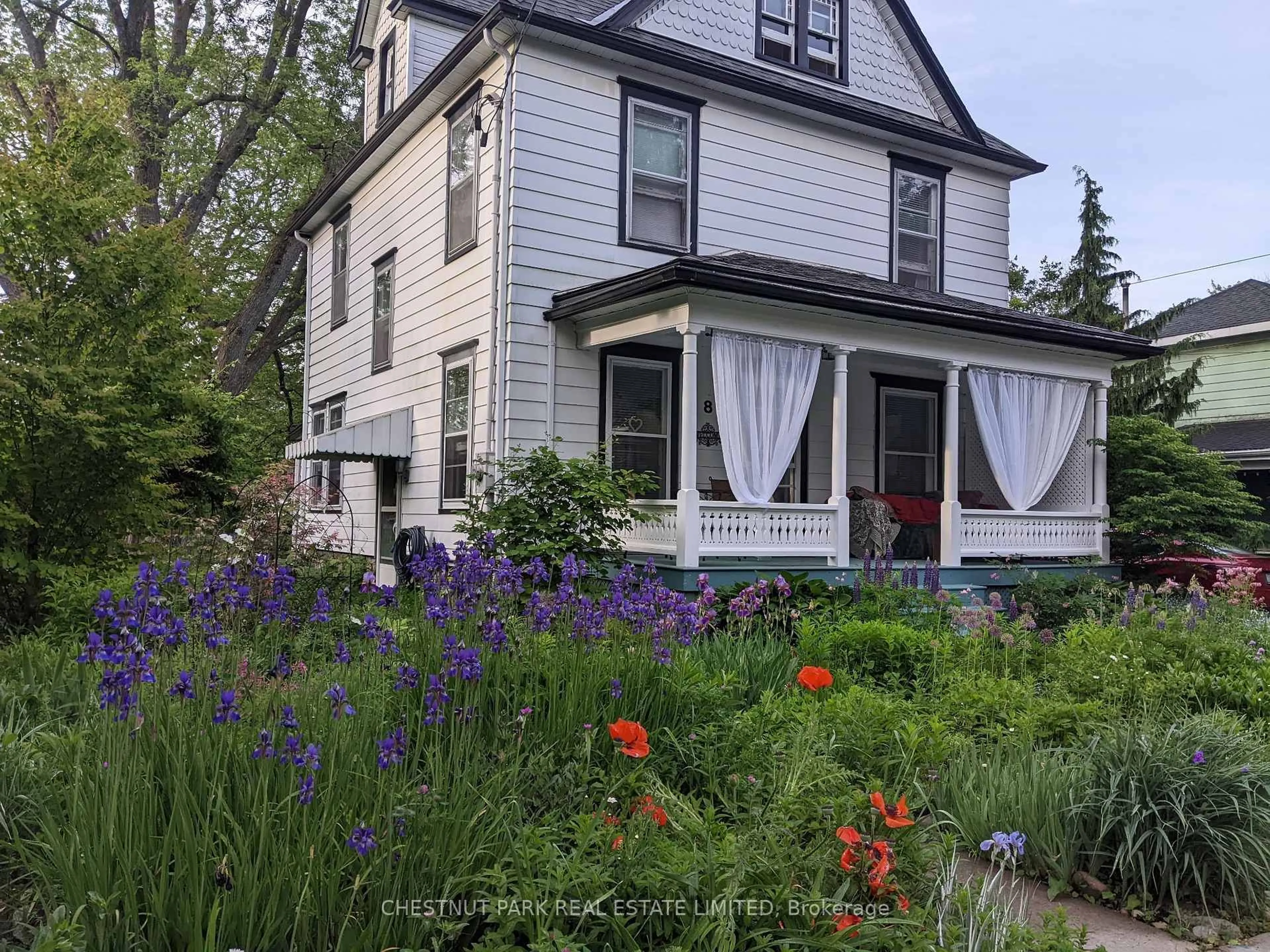 Home with vinyl exterior material, street for 8 Queen St, Prince Edward County Ontario K0K 2T0