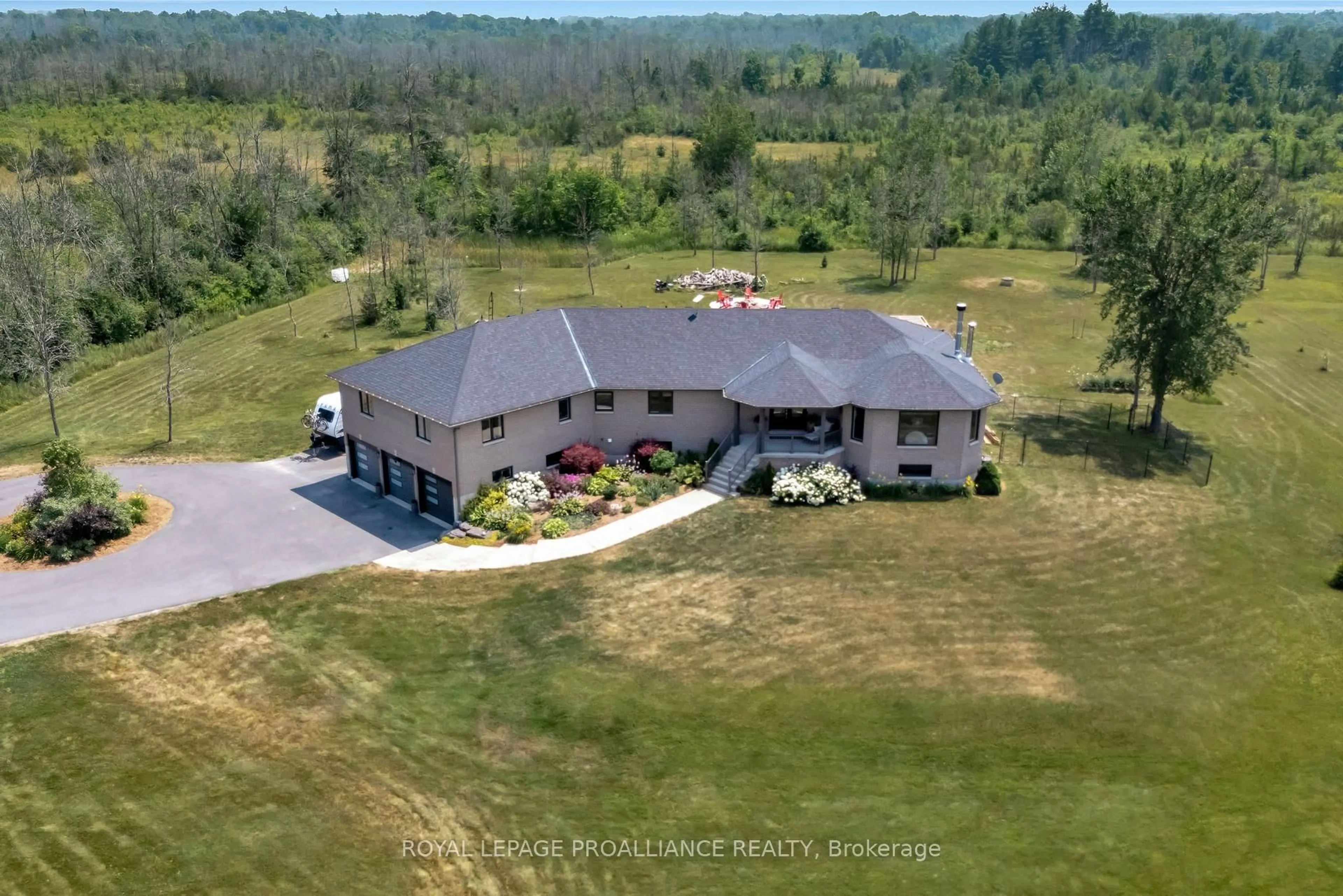 A pic from outside/outdoor area/front of a property/back of a property/a pic from drone, building for 6282 County Road 2, Bissett Creek Ontario K0H 2H0
