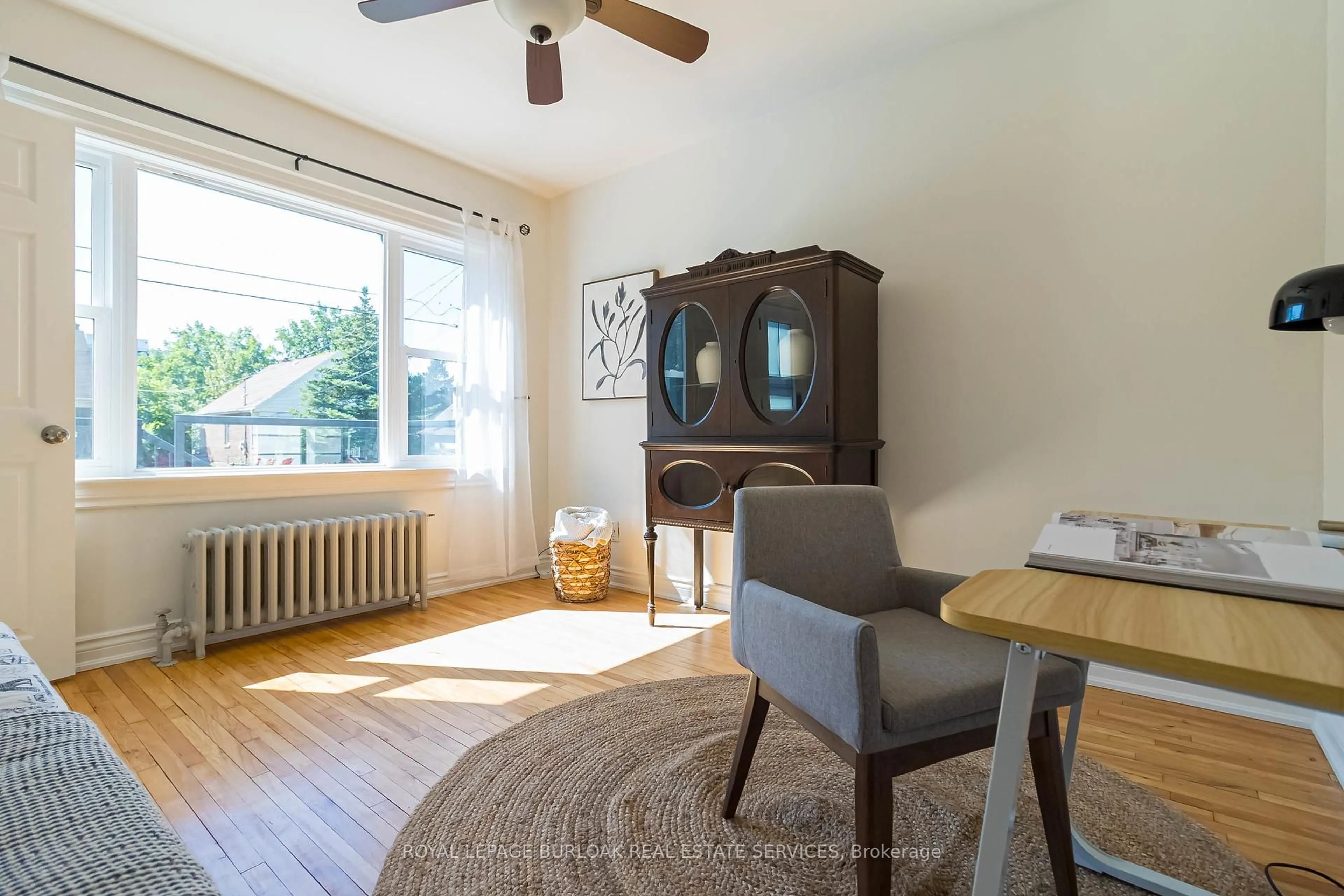 Living room with furniture, wood/laminate floor for 116 1st St, Hamilton Ontario L8G 1Y4