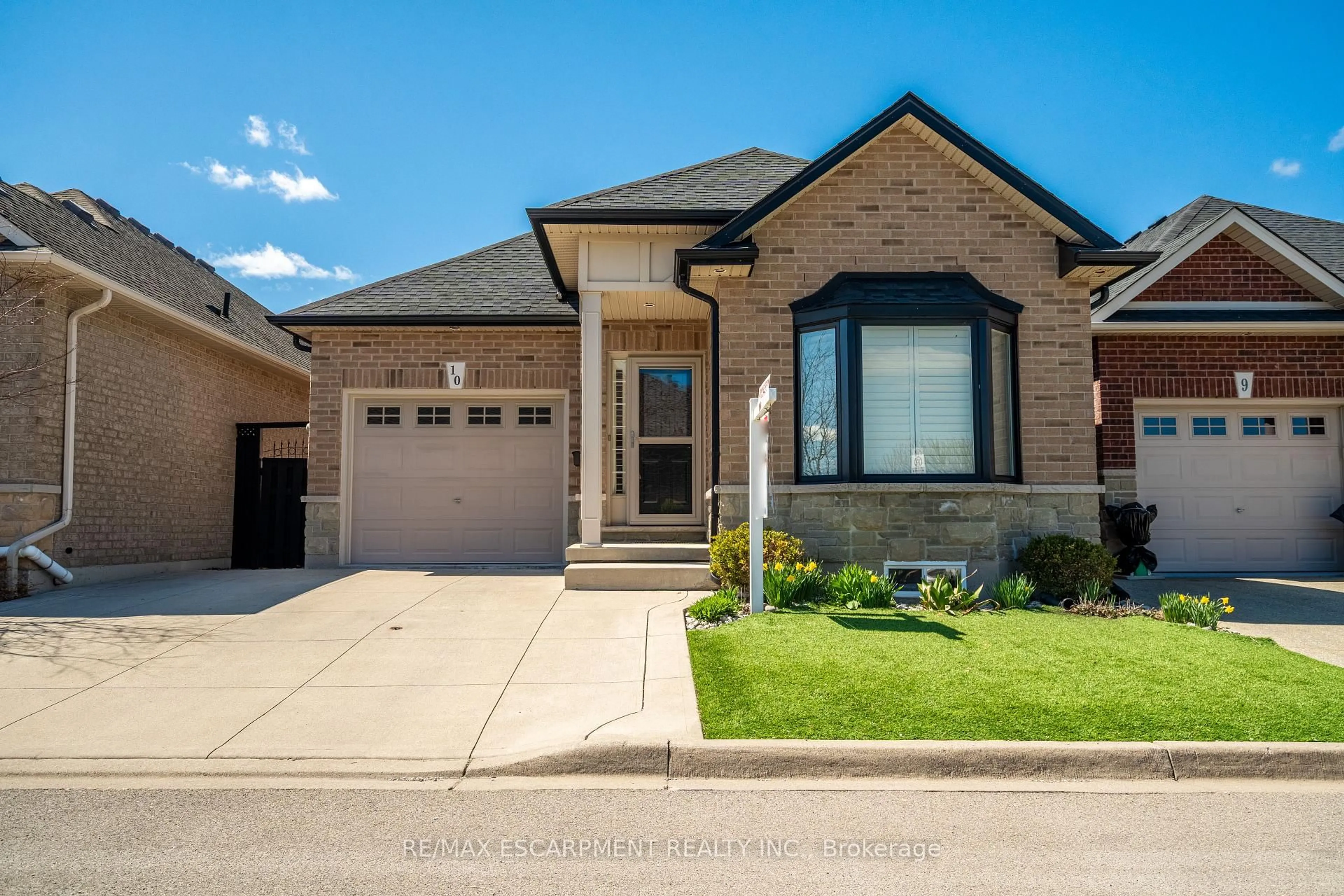 Home with brick exterior material, street for 10 Greenbrook Dr #10, Hamilton Ontario L8G 0A2