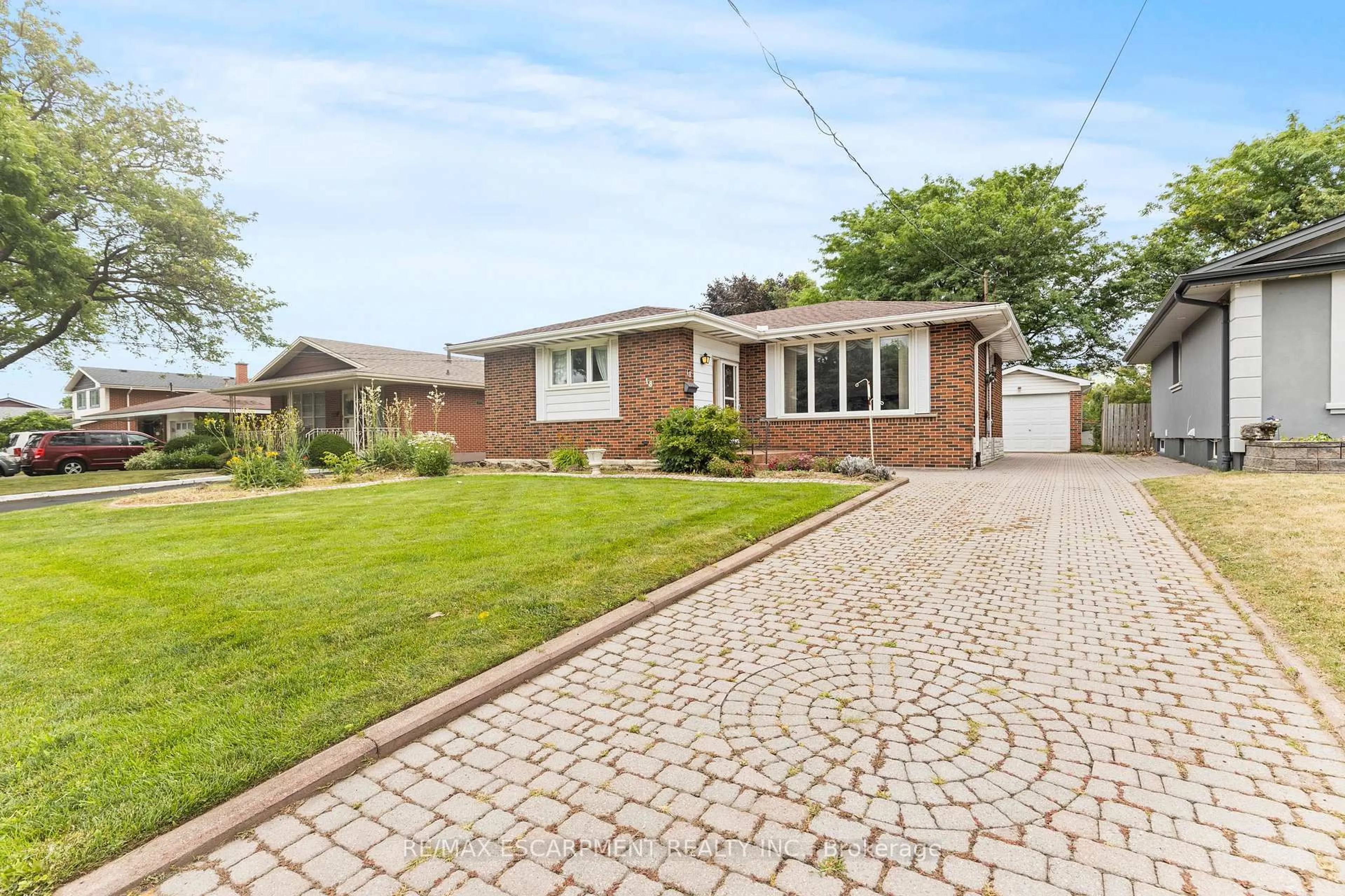 Home with brick exterior material, street for 18 Owen Pl, Hamilton Ontario L8G 2H2
