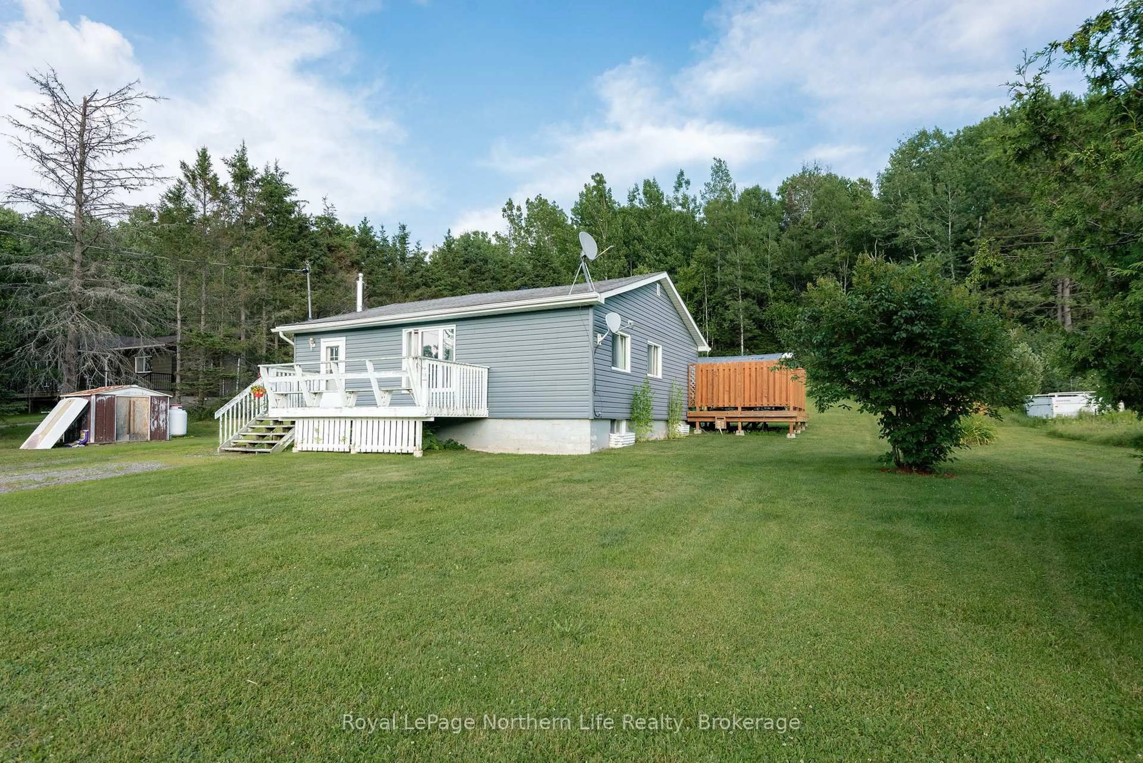A pic from outside/outdoor area/front of a property/back of a property/a pic from drone, water/lake/river/ocean view for 106 Highway 531, Bonfield Ontario P0H 1E0
