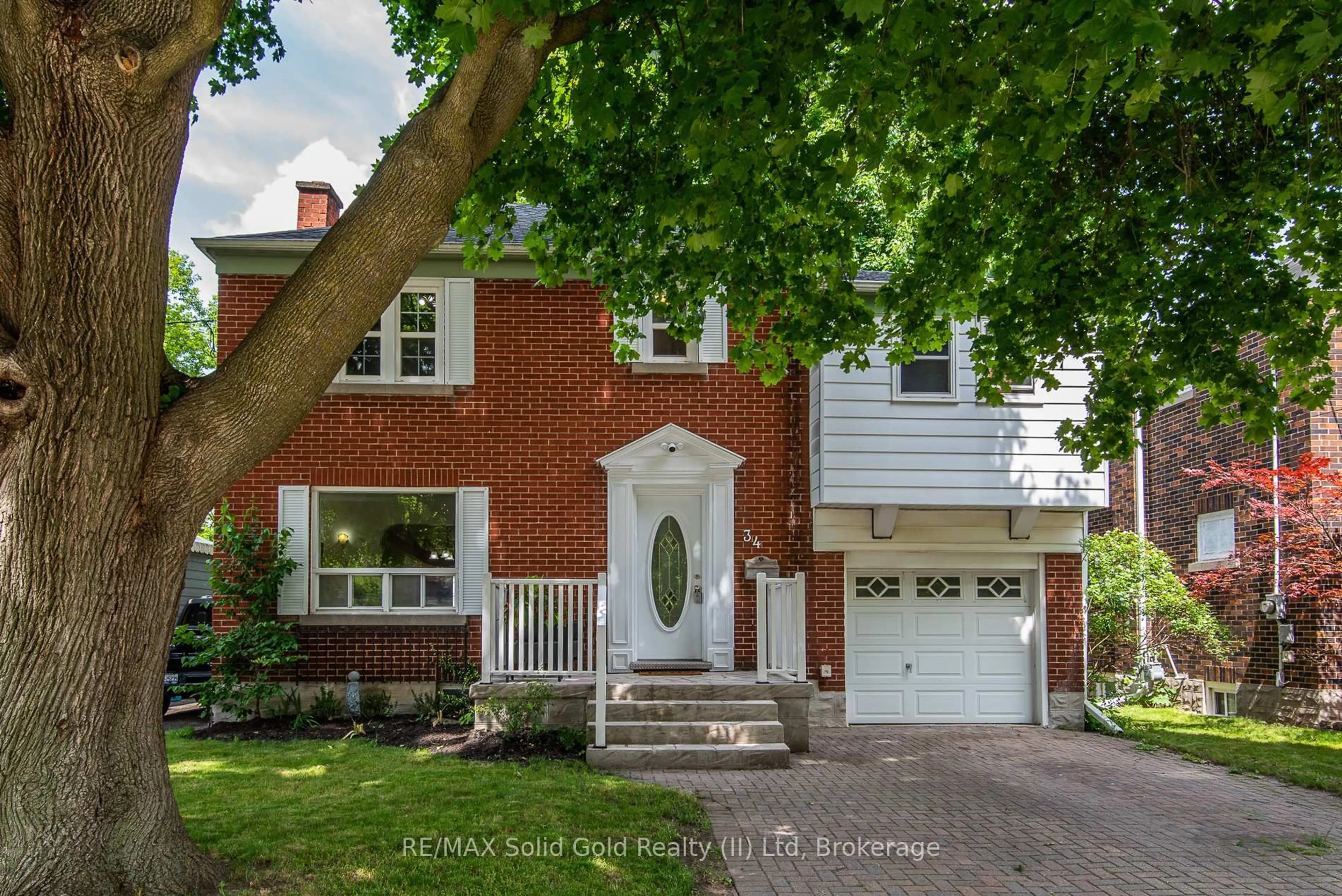 Home with brick exterior material, street for 34 Moore Ave, Waterloo Ontario N2J 3E5