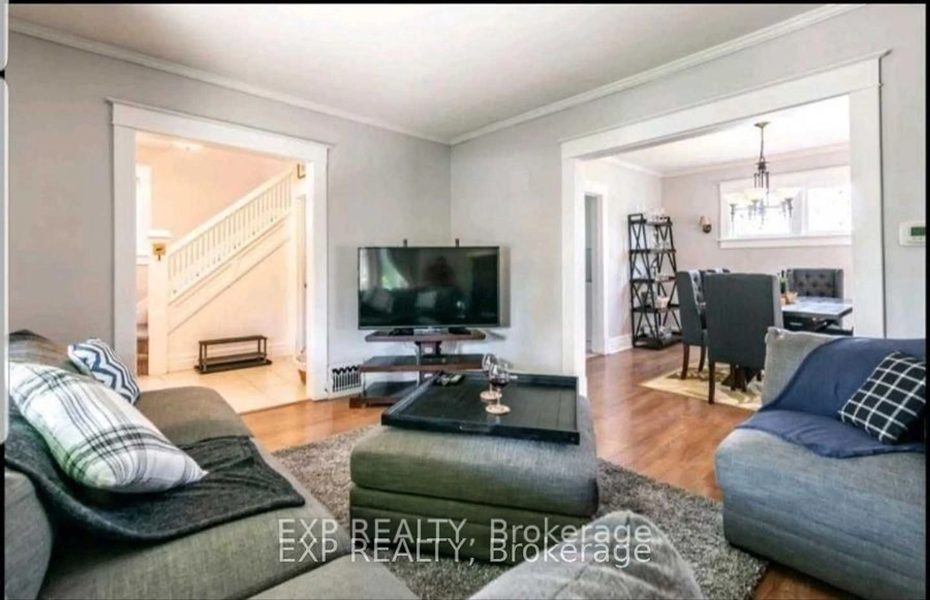 Living room with furniture, wood/laminate floor for 5037 Jepson St, Niagara Falls Ontario L2E 1K4