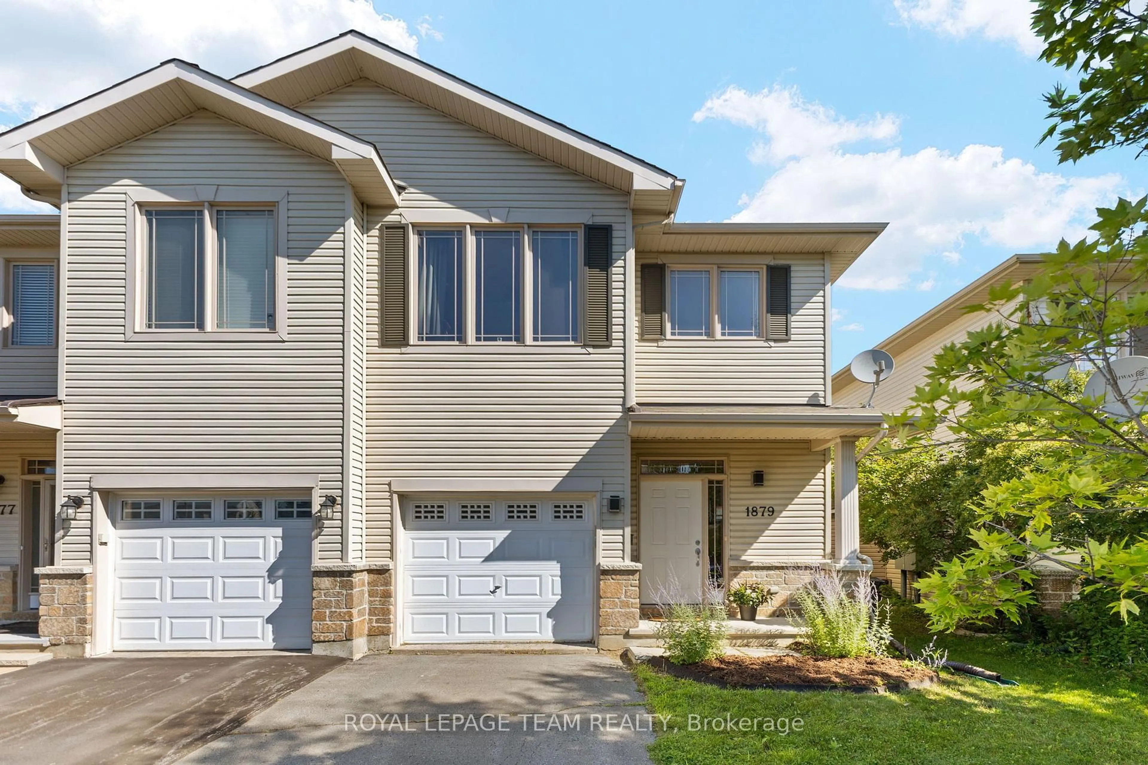 Home with vinyl exterior material, street for 1879 Arrowgrass Way, Ottawa Ontario K4A 0C9