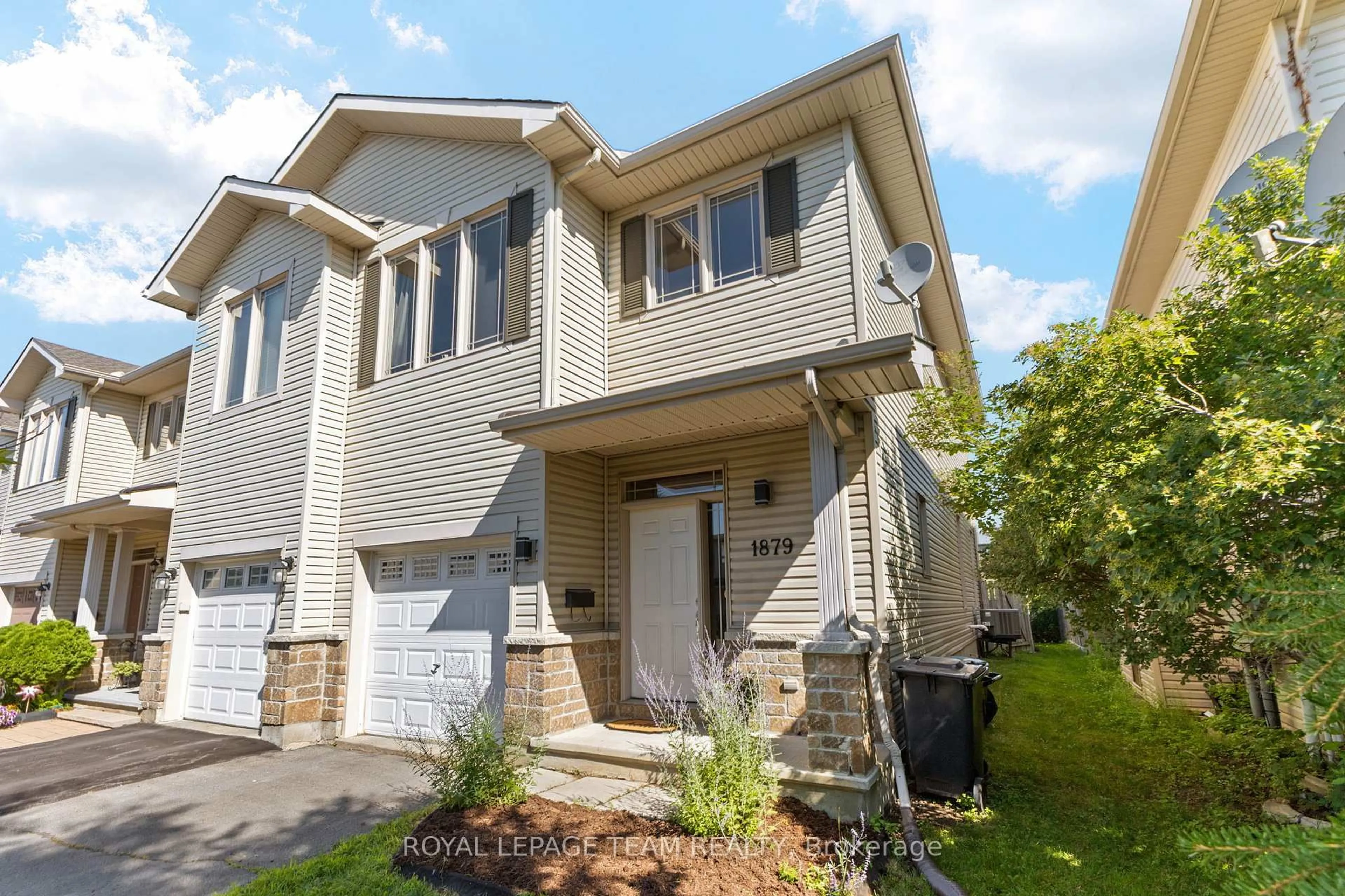 Home with vinyl exterior material, street for 1879 Arrowgrass Way, Ottawa Ontario K4A 0C9