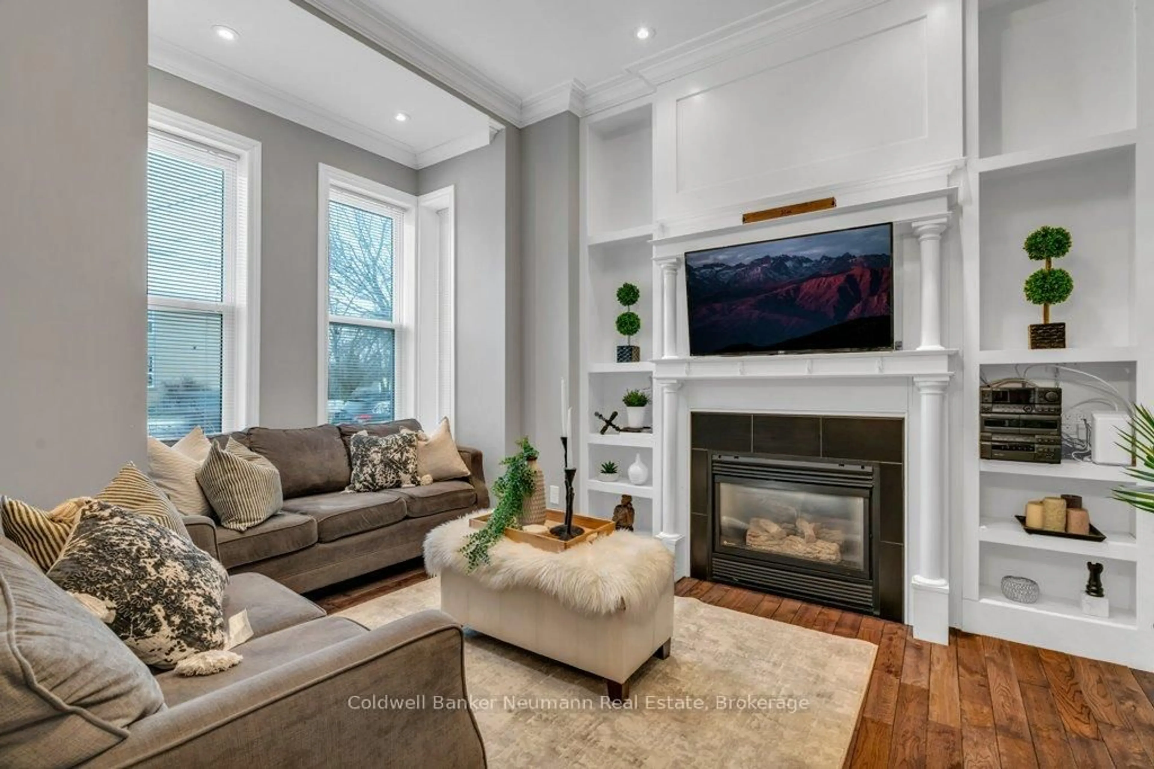 Living room with furniture, wood/laminate floor for 394 Woolwich St, Guelph Ontario N1H 3Y7