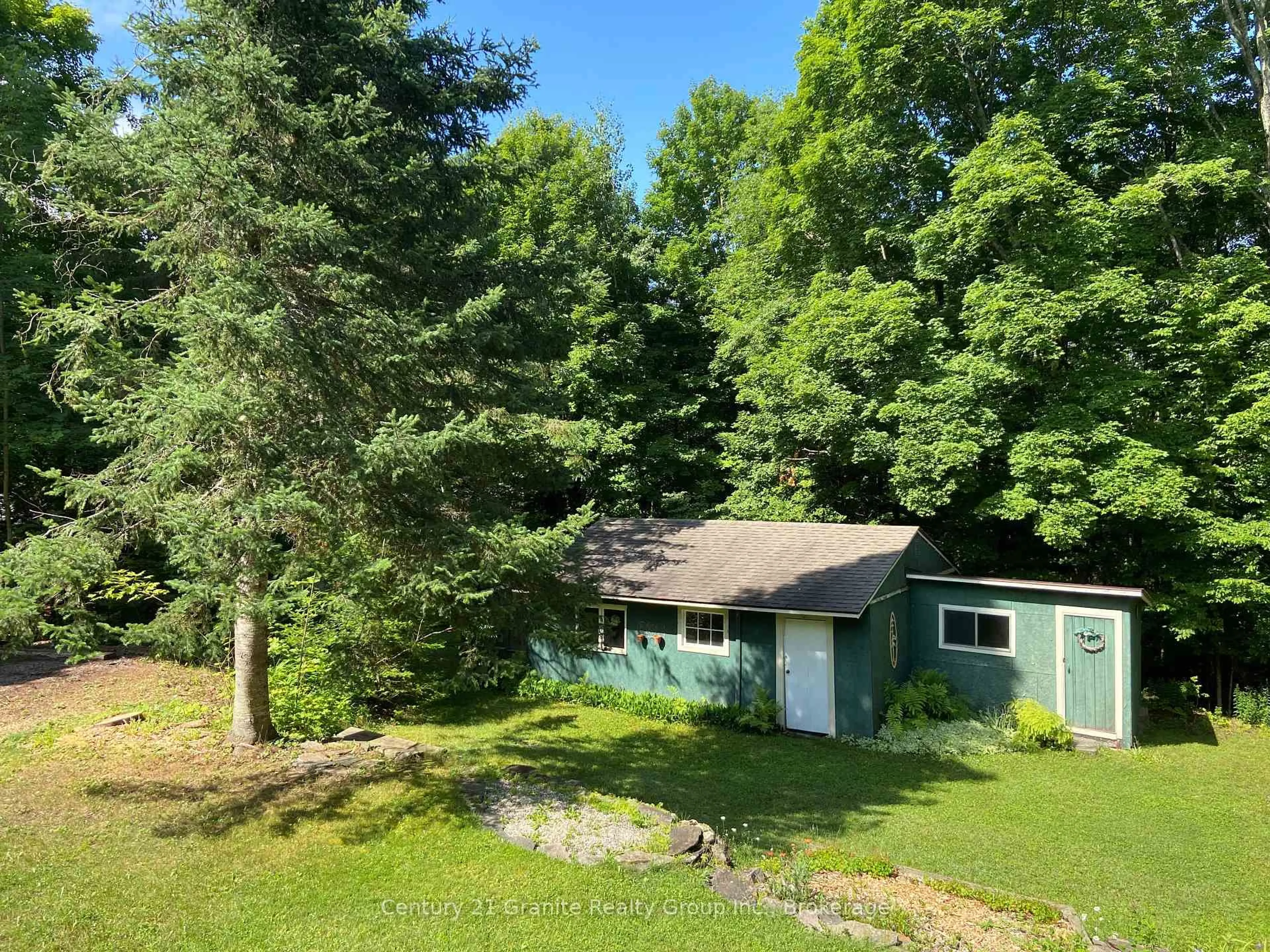 A pic from outside/outdoor area/front of a property/back of a property/a pic from drone, forest/trees view for 1931 Duck Lake Rd, Minden Hills Ontario K0M 1S0