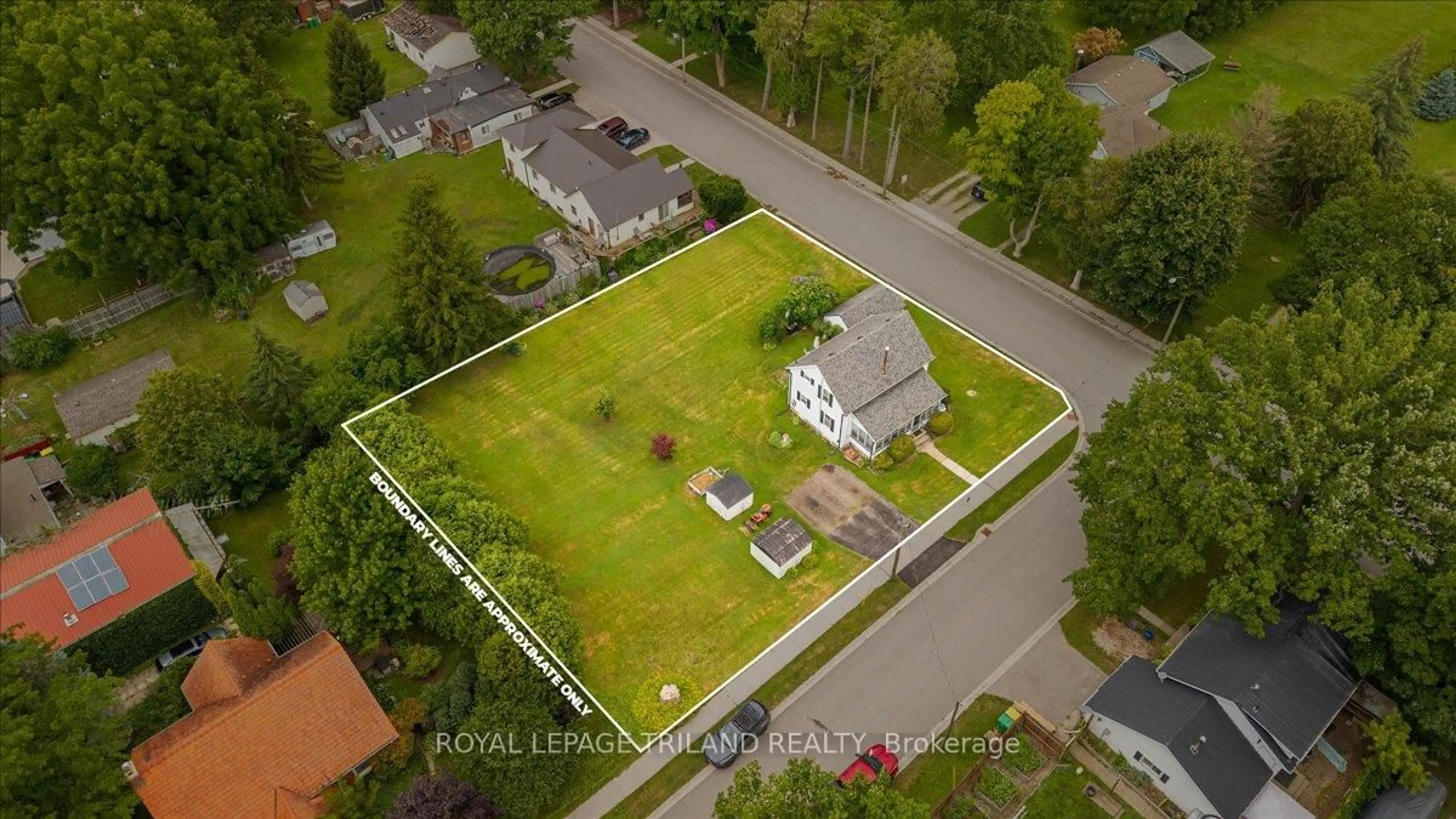 A pic from outside/outdoor area/front of a property/back of a property/a pic from drone, street for 21 Elgin St, Southwest Middlesex Ontario N0L 1A0