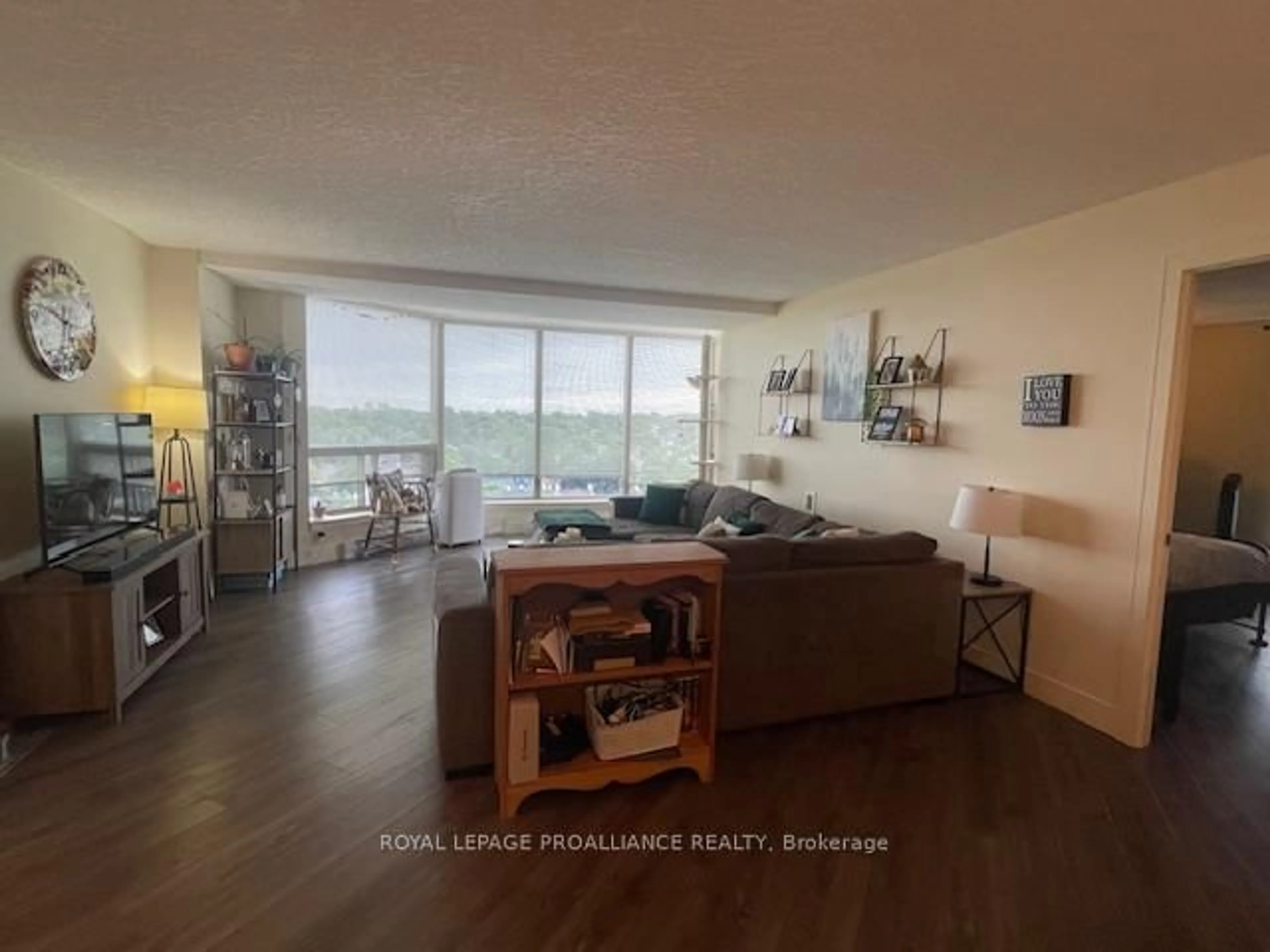 Living room with furniture, wood/laminate floor for 344 Front St #1002, Belleville Ontario K8N 5M4