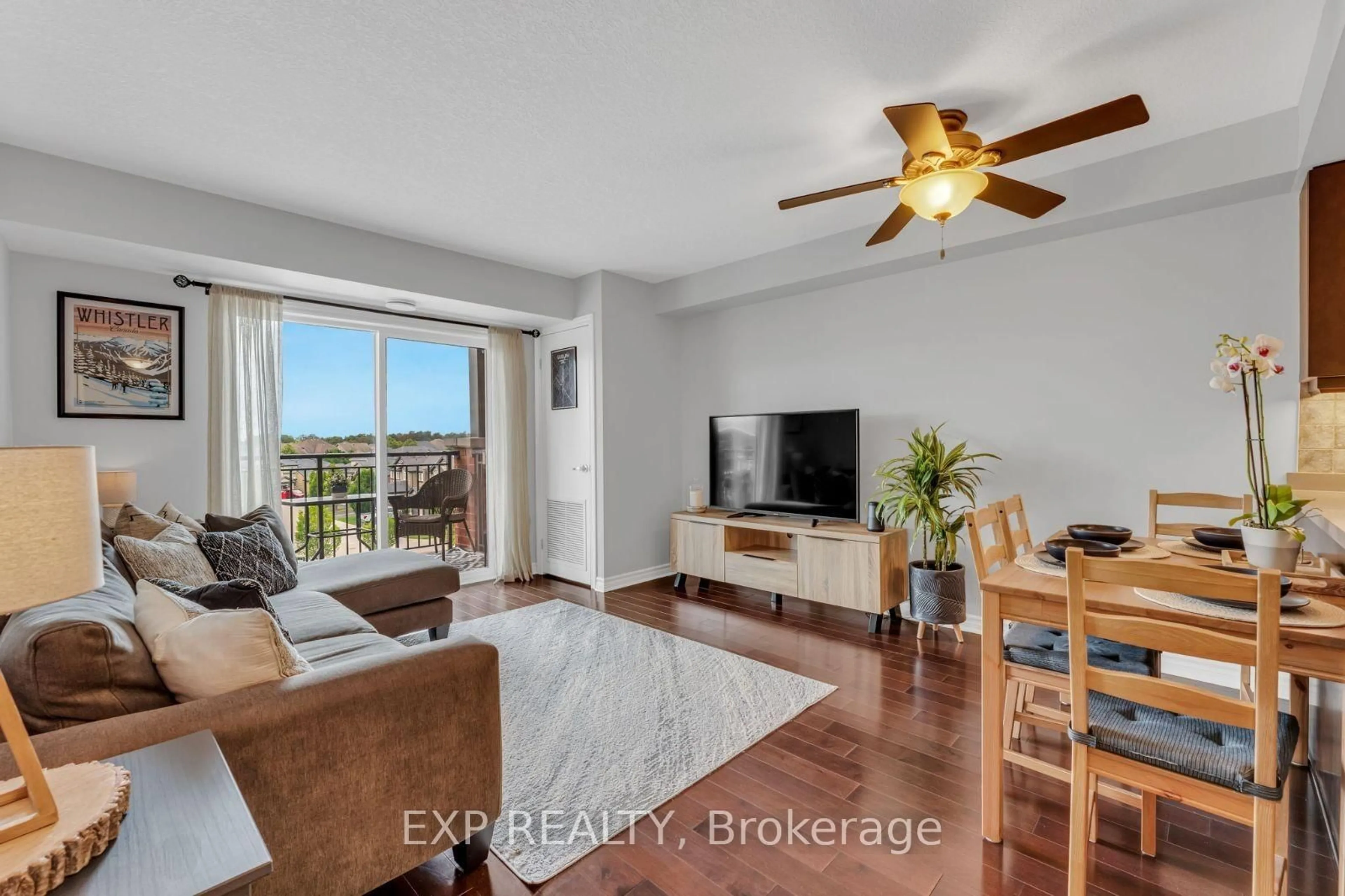 Living room with furniture, wood/laminate floor for 60 Lynnmore St #414, Guelph Ontario N1L 0J8