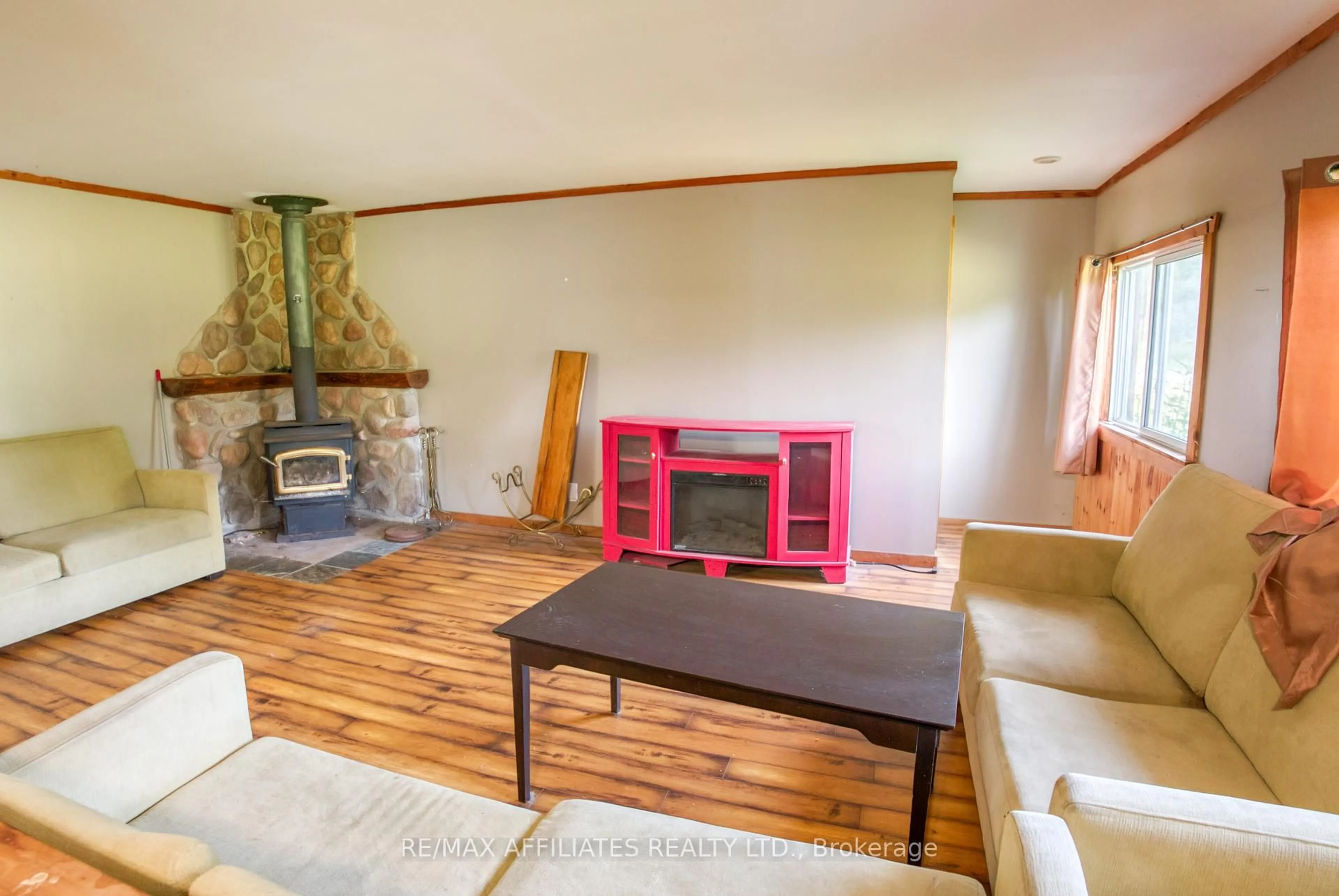 Living room with furniture, wood/laminate floor for 2843 Highway 15 Highway, Rideau Lakes Ontario K0G 1V0